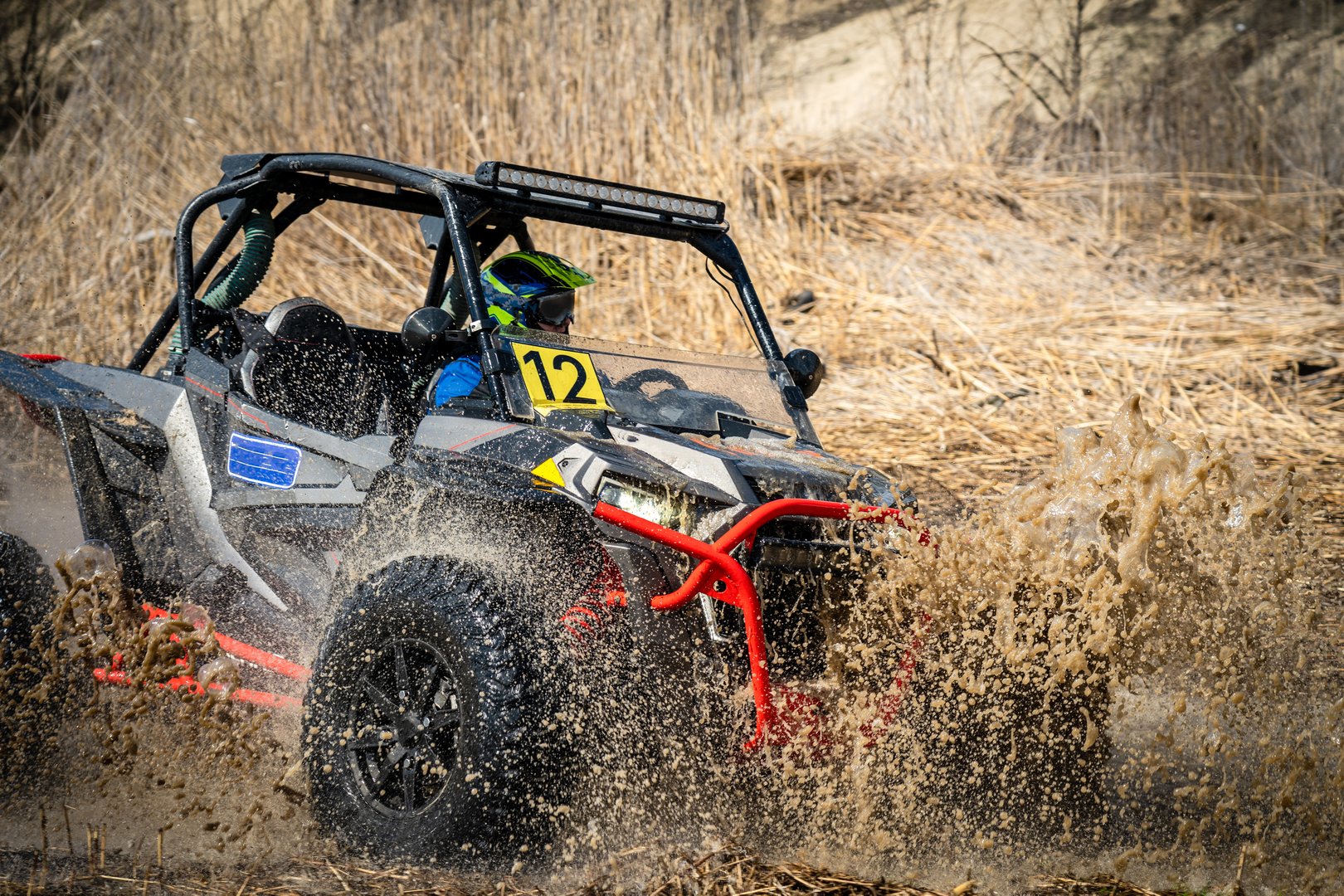 Active ATV and UTV Off-Road vehicle in muddy water. ATV 4x4