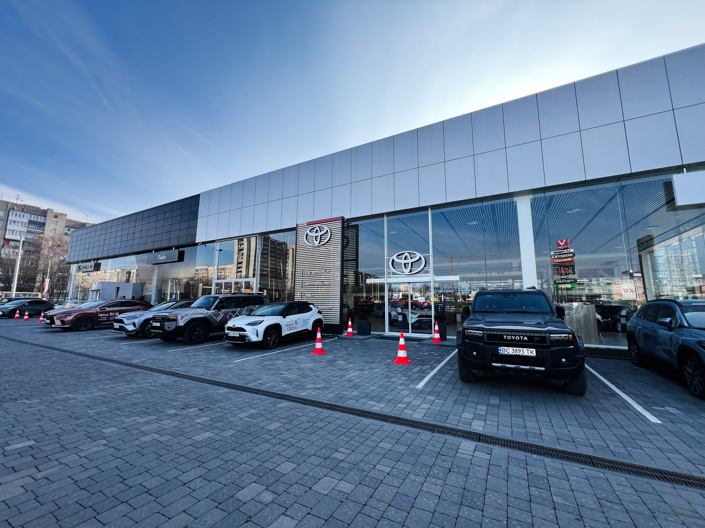 Lviv, Ukraine - February 12, 2025: Showcasing a car dealership building featuring Toyota vehicles in a contemporary urban environment