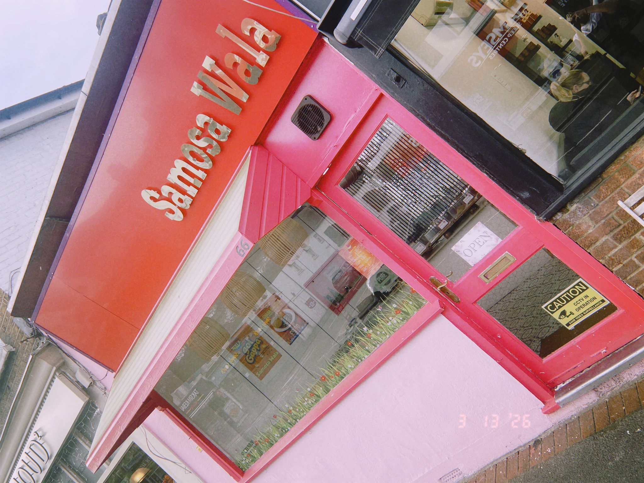 Samosa Wala shop with blue board signage showing Samosa Wala