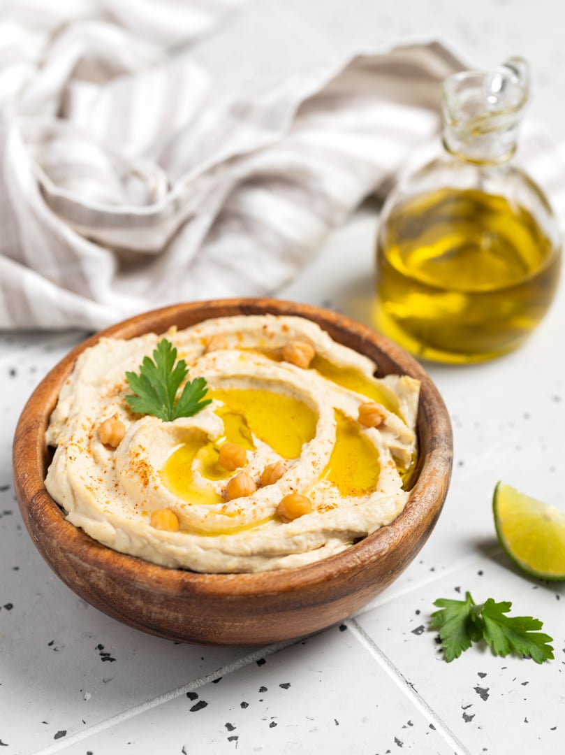 Homemade and vegan hummus with lime. Tasty vegan snack.
