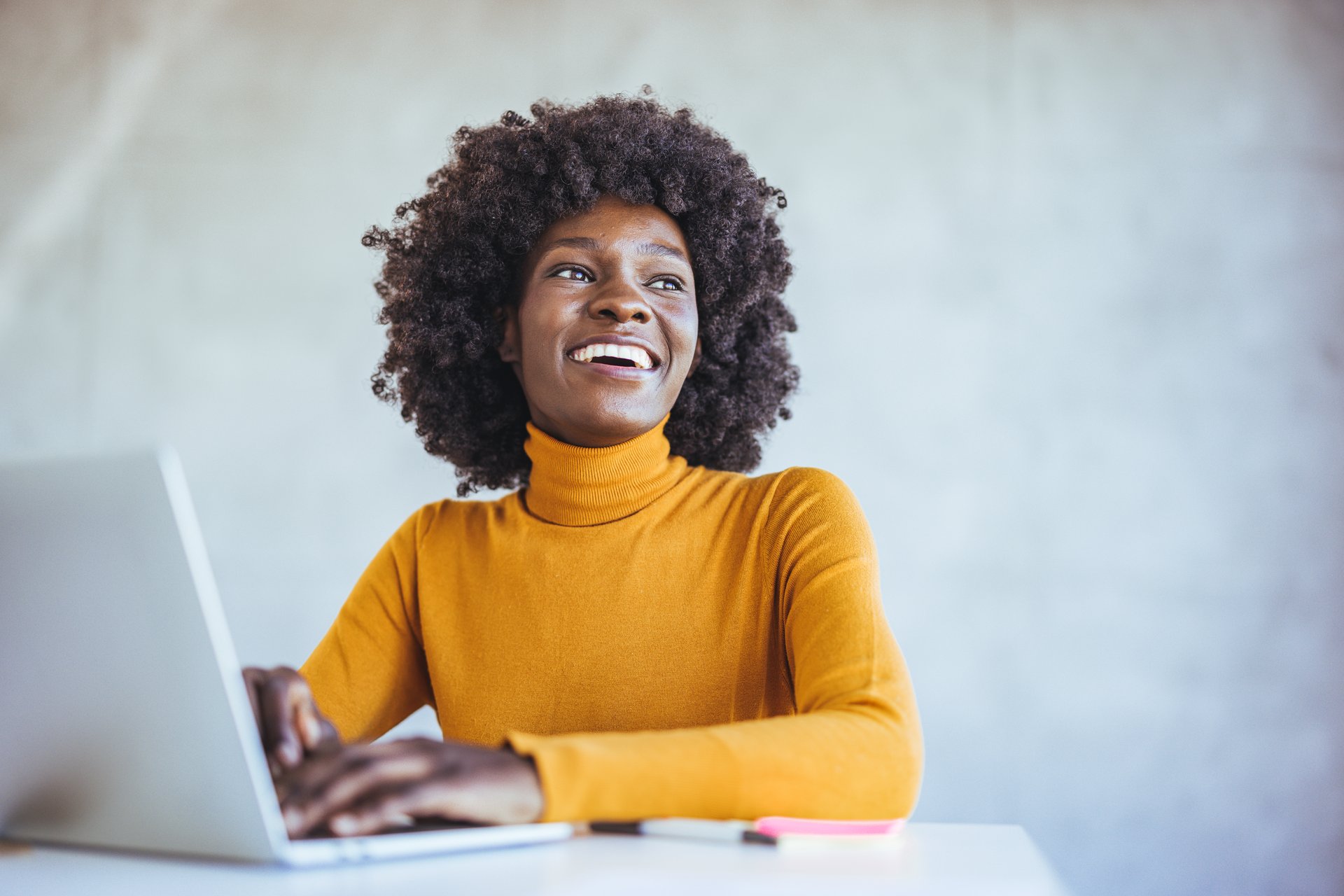 Thinking about how to take the business to technological heights. Cropped shot of an attractive young businesswoman working in her office. Image of woman using laptop while sitting at her desk