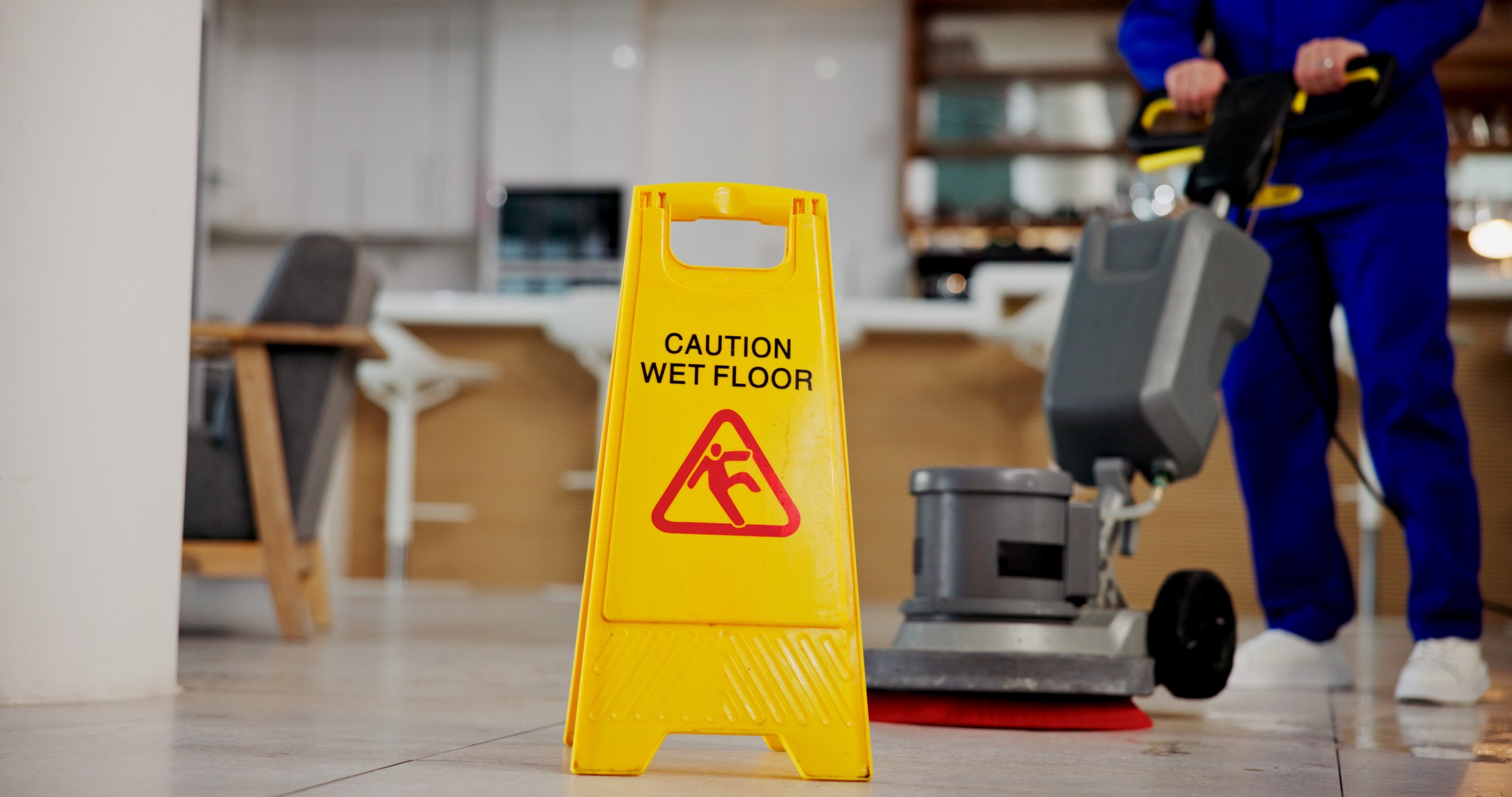 Cleaning, service and caution for wet floor, sign and person with equipment for hygiene or business. Board, information and warning for safety, disinfection and routine for sanitation of coffee shop