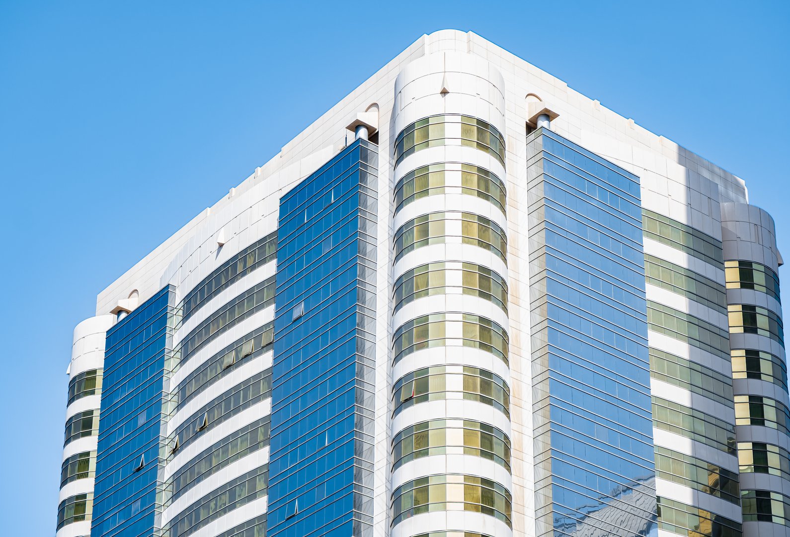 Modern residential apartment with flat buildings exterior. New luxury house and home complex. Real estate property, condo architecture with Blue sky. Residential area with modern apartment buildings