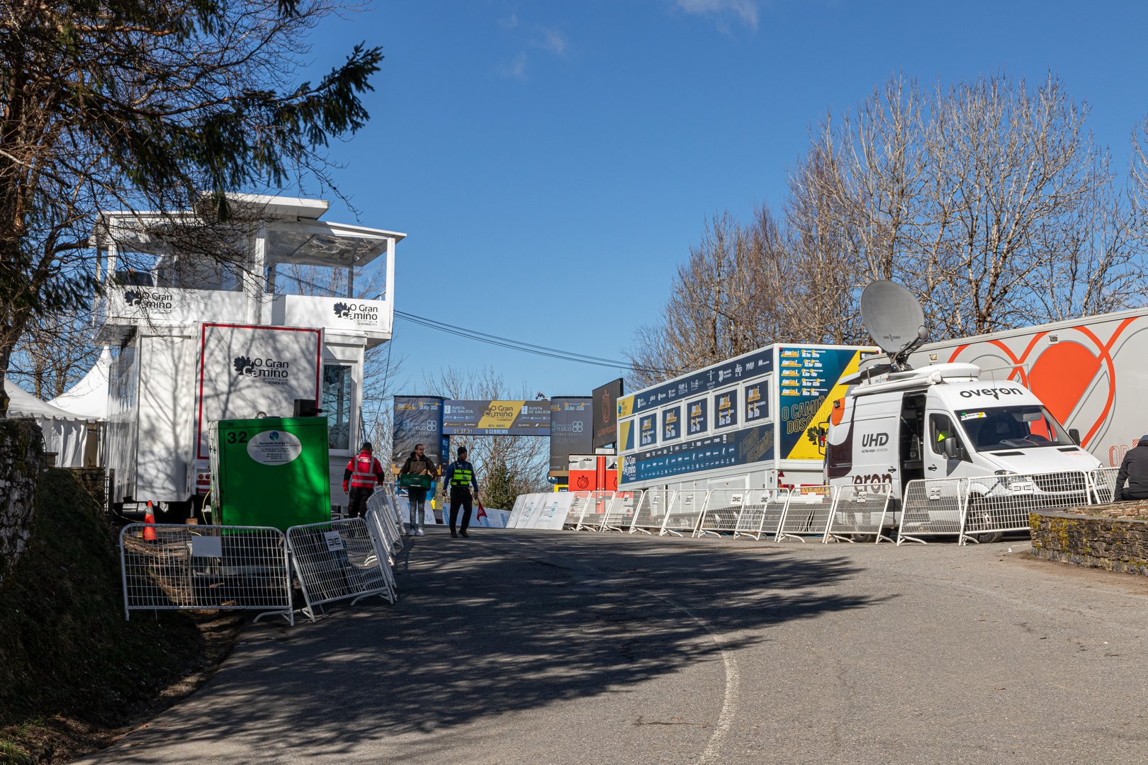 O Cebreiro, Spain. Event structures and banners set up for the finish line of an O Gran Camino 2025 stage in O Cebreiro, with logos of sponsors and race organizers visible