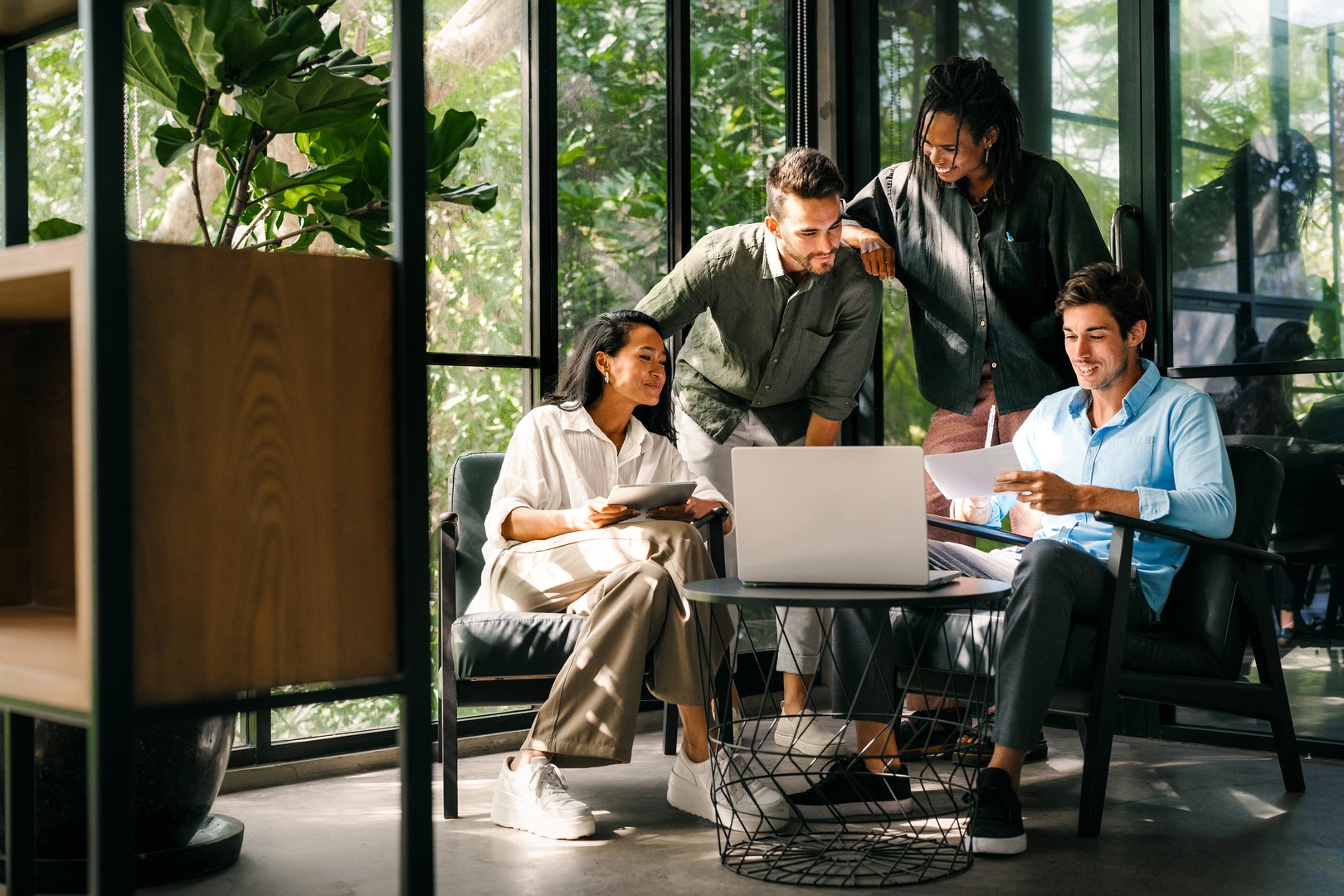 Success diverse group of multiethnic entrepreneurs and business people achieving goals in corporate office