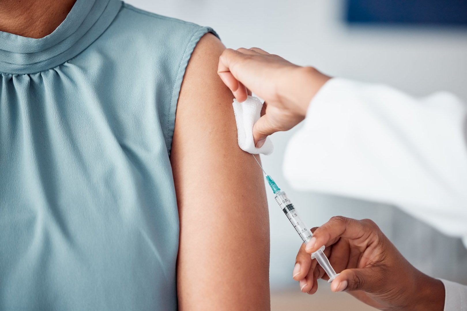 Hands, medical and doctor with patient for vaccine in a clinic for healthcare treatment for prevention