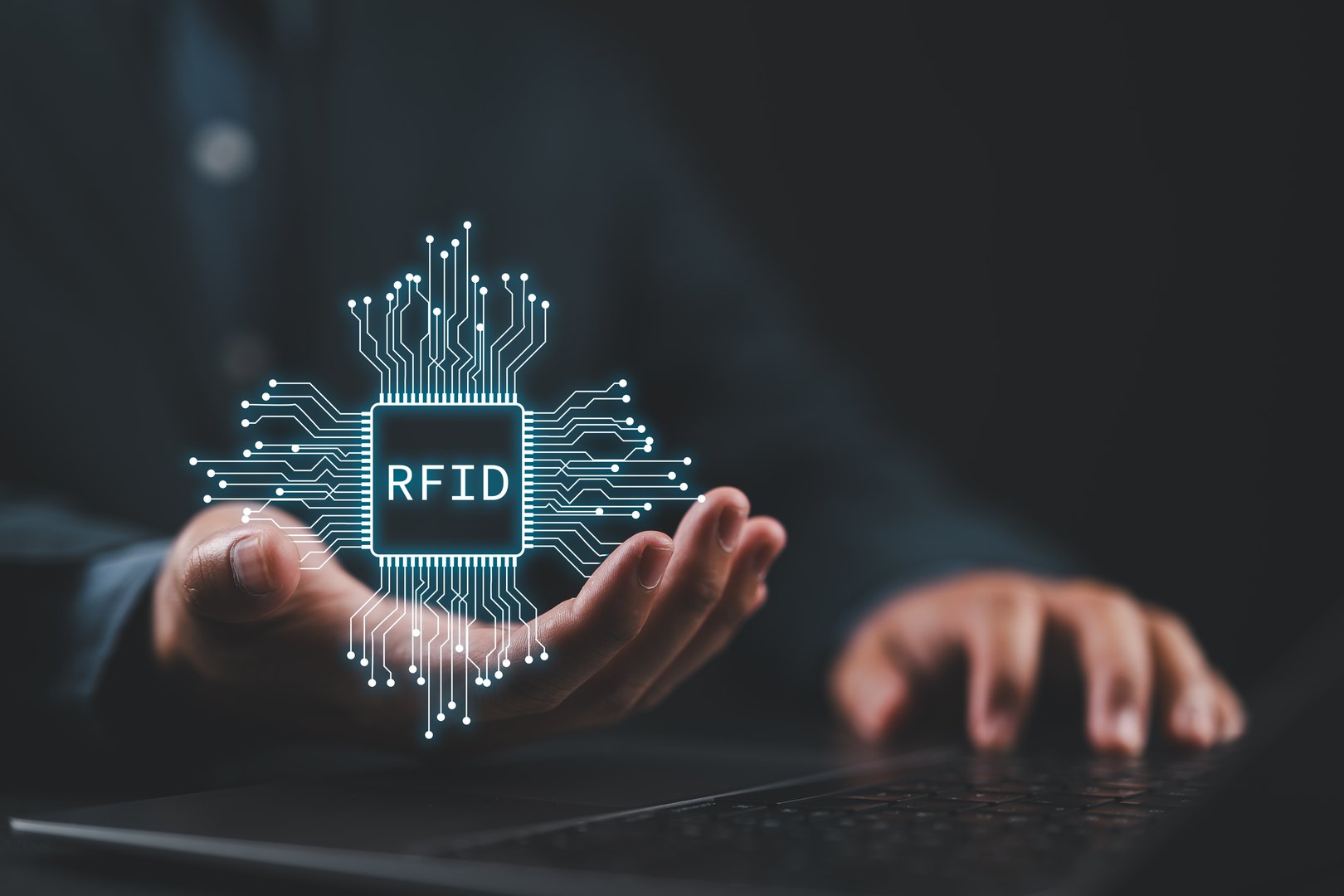RFID, Radio Frequency Identification concept. Electronic data storage system that enhances computational capabilities and data security. Man with RFID technology on virtual screen.