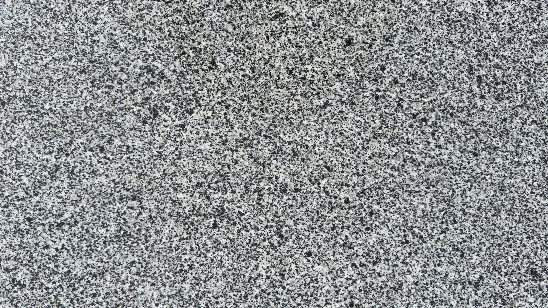 Texture of gray polished granite close-up