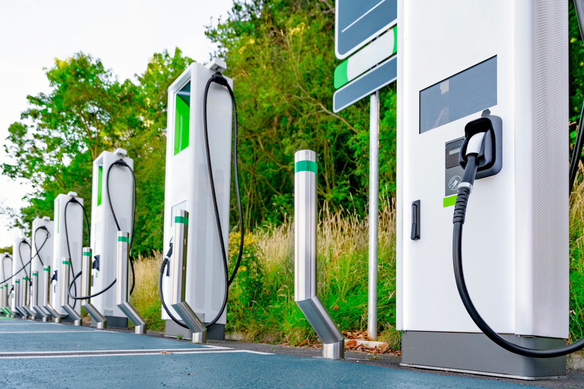 Innovative electric vehicle charging station in a lush green setting showcases modern technology for eco-friendly transportation