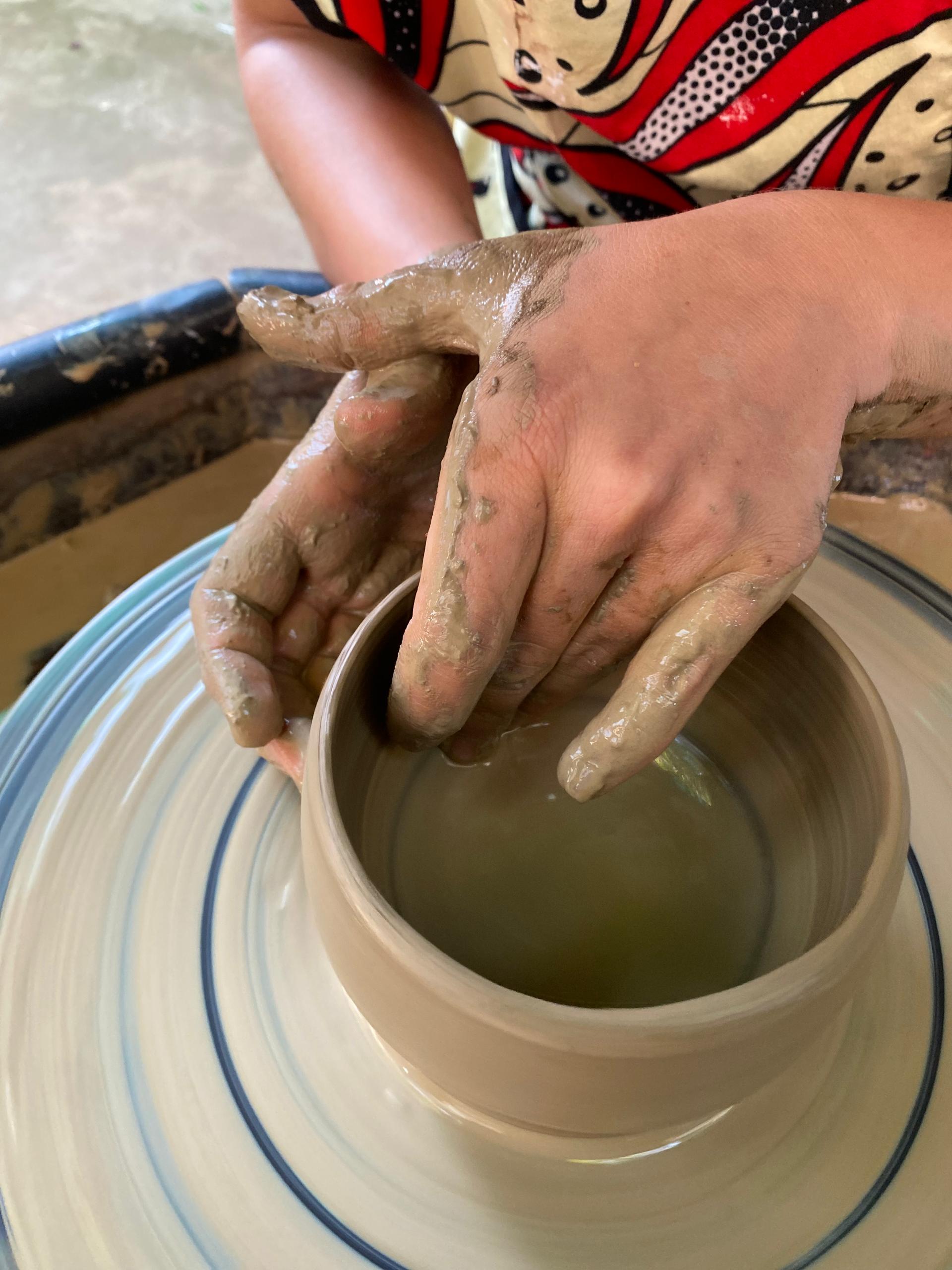 Ugandan artisan working on traditional crafts