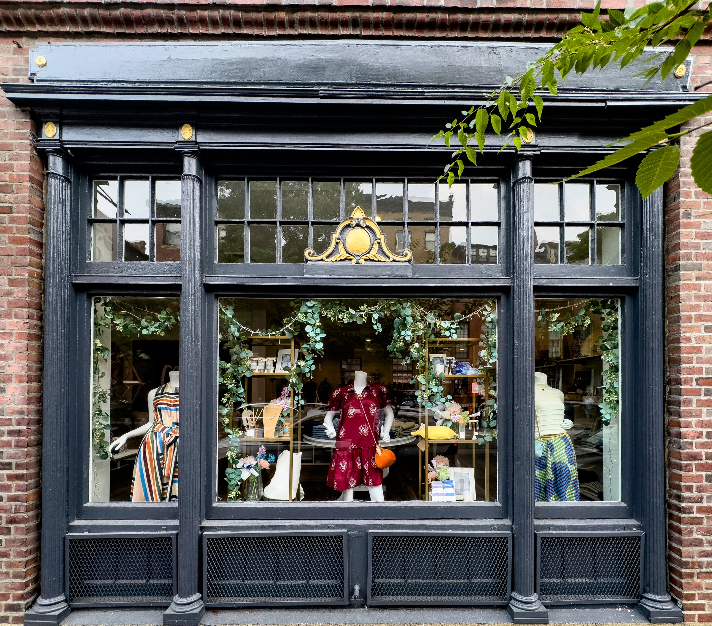 Boston, MA USA August 2, 2024: A nicely-decorated dress shop located on Charles Street at the foot of Beacon Hill in Boston.
