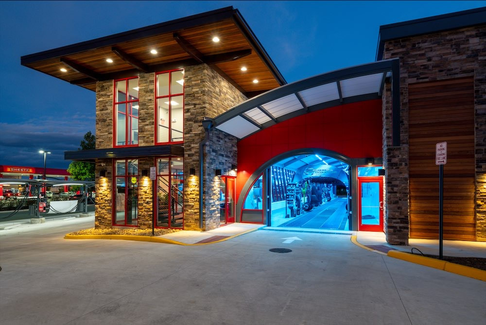 Modern glass car wash facility with contemporary design and professional equipment