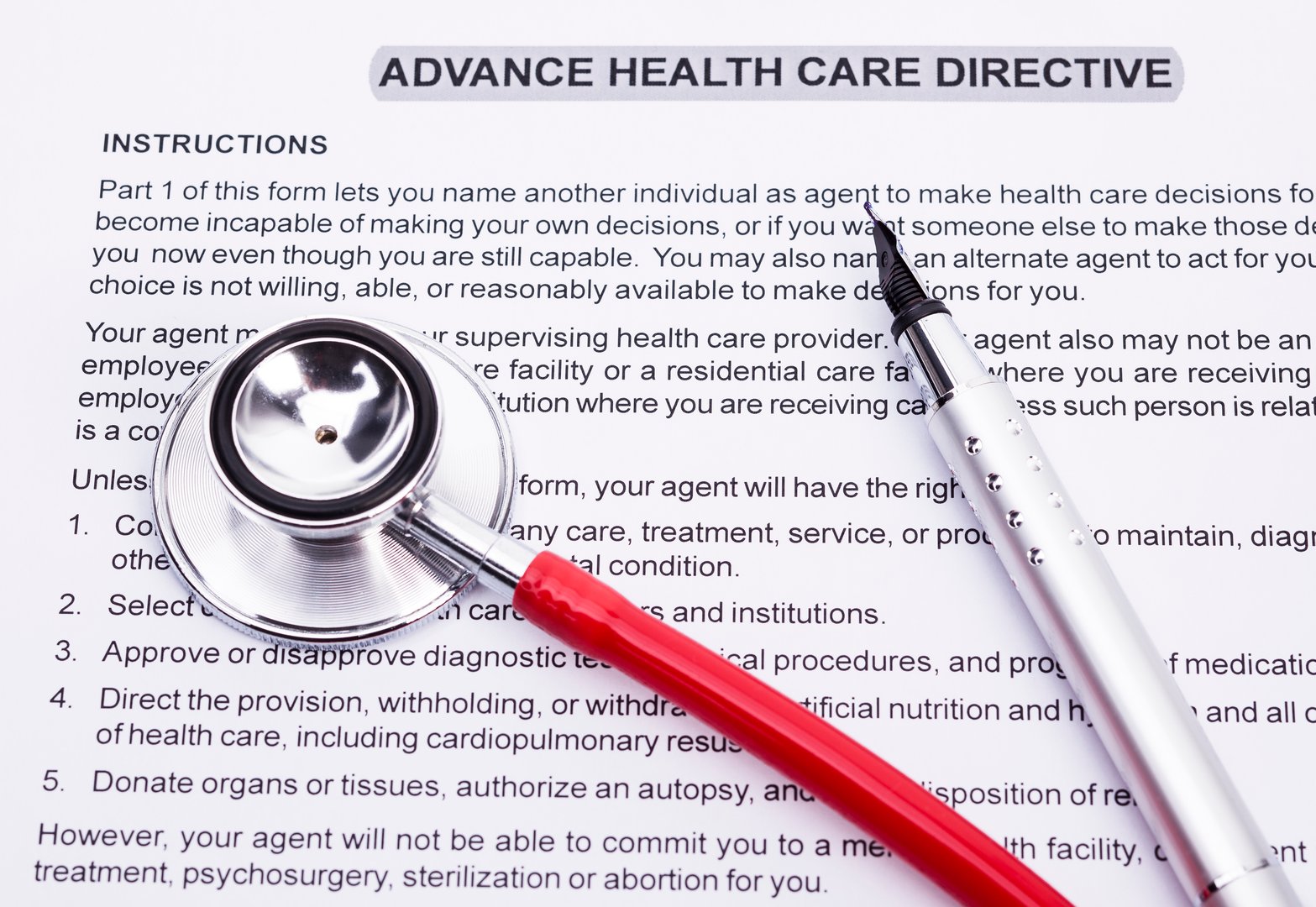 Image shows an advanced directive, a stethoscope and a pencil