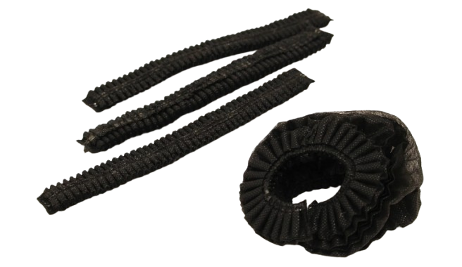 Four black elastic hair bands, three straight and one coiled, on a white background.