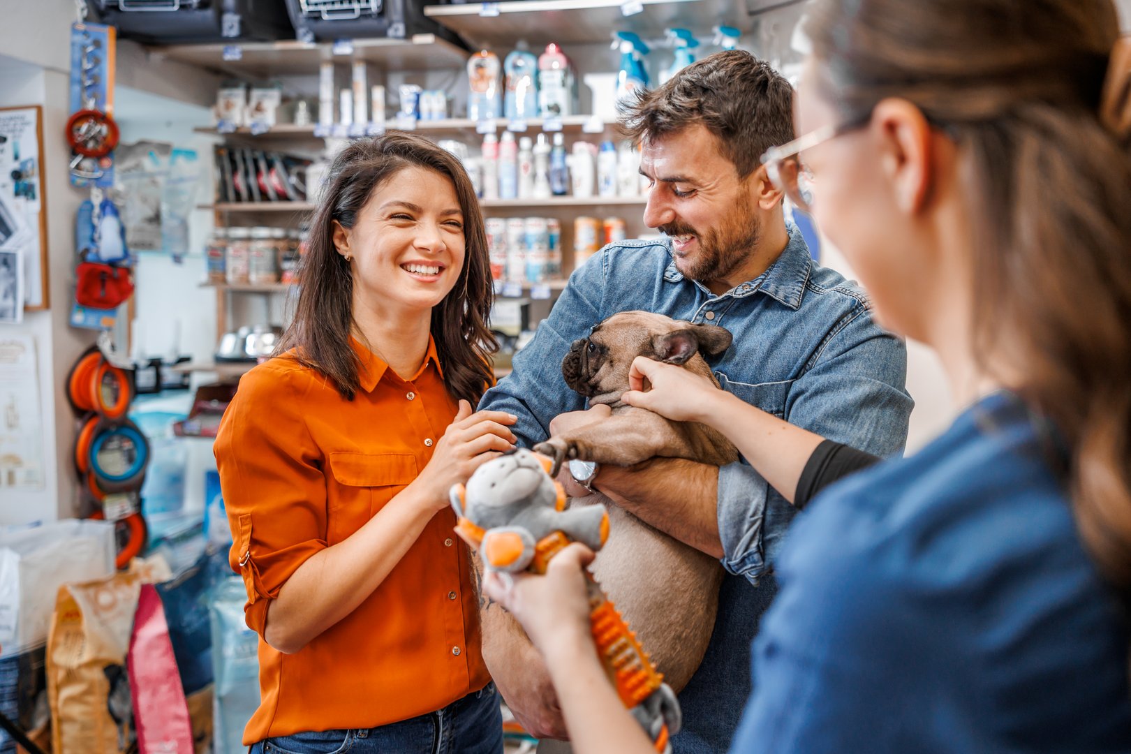 Amidst shelves stocked with a variety of pet products, pet parents enjoy a leisurely shopping experience, selecting treats, toys, and grooming essentials to spoil their furry family members.