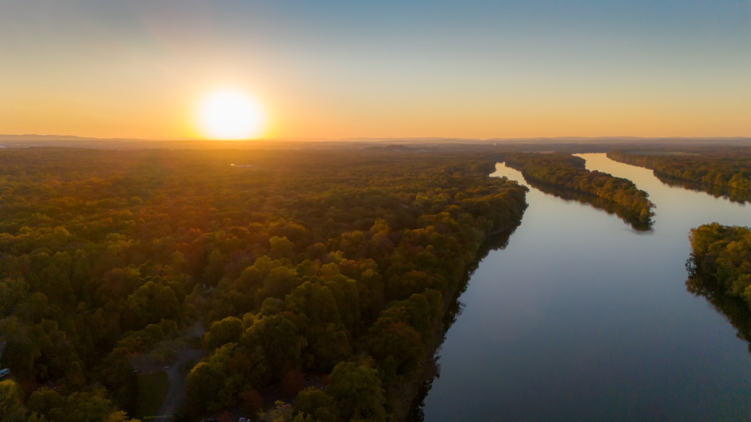 Aerial view of sunset over river