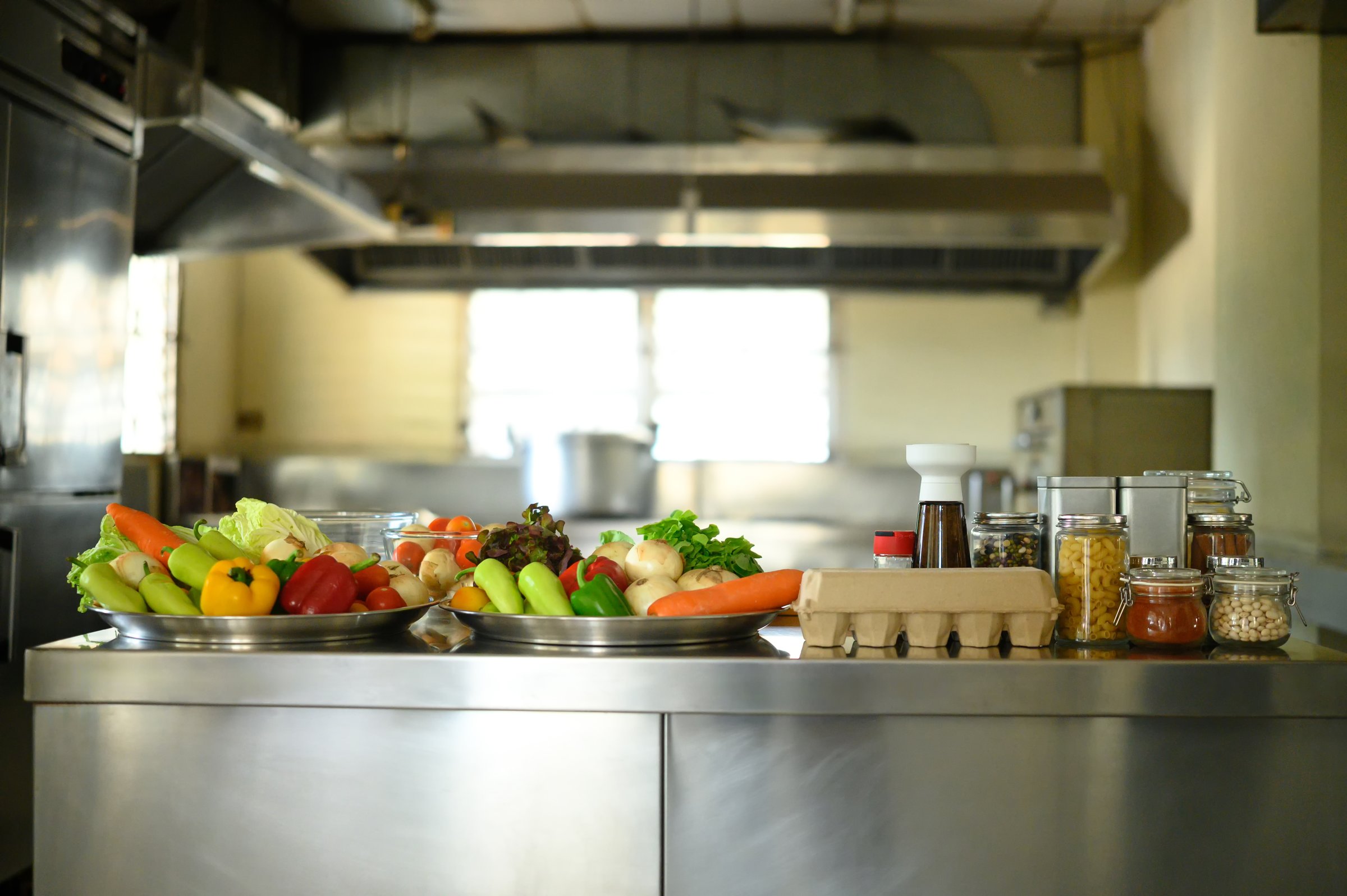 Fresh vegetables and ingredients on a counter ready for cooking class at a culinary school.