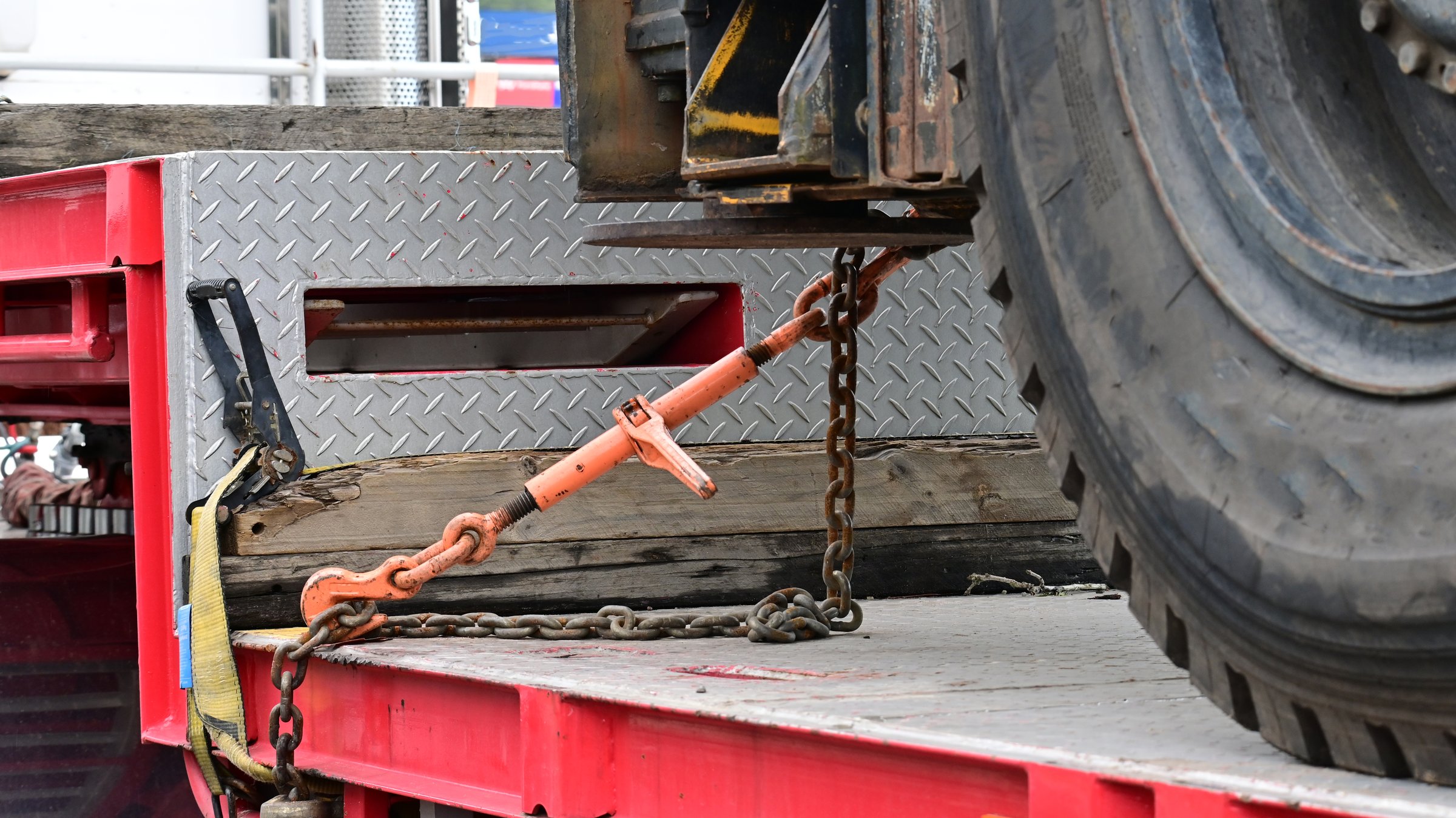Tie down ratchet and chain on a flat bed trailer