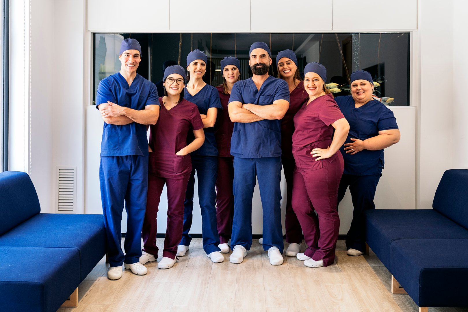 Stock photo of workers of dental clinic smiling and looking at camera.