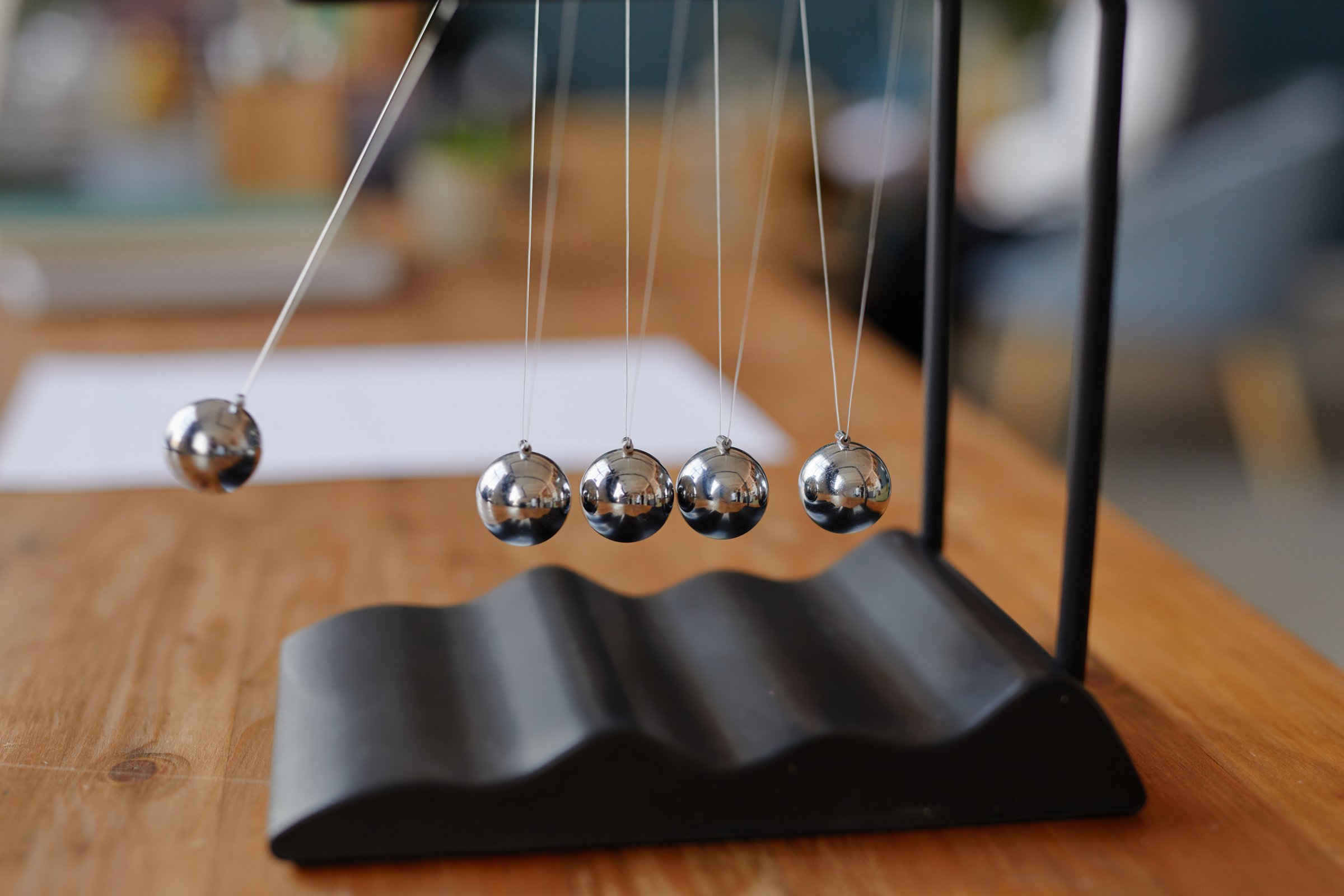 Newton cradle demonstrating physics concept
