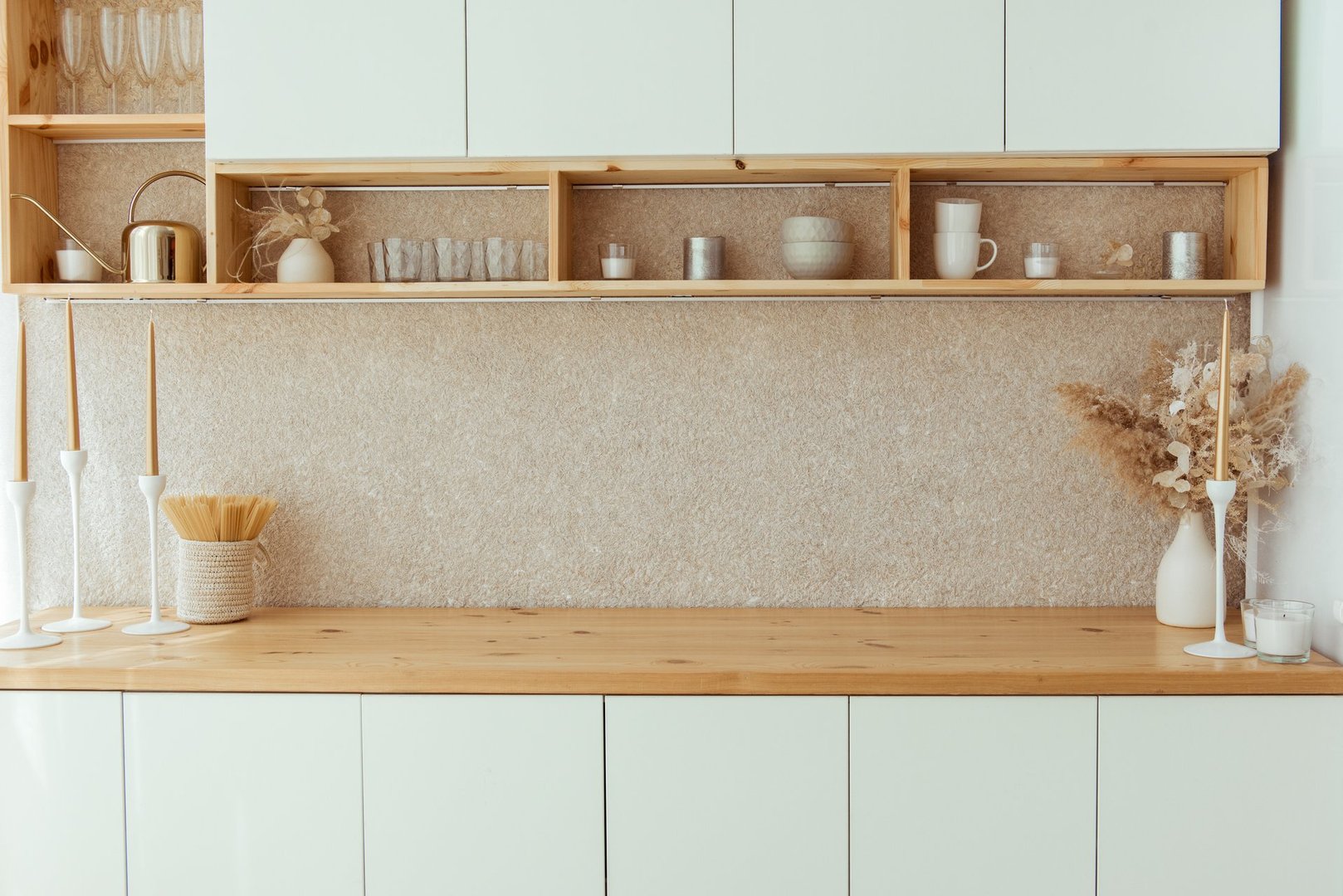 Kitchen shelves with various white ceramic, glass jars. Open shelves in the kitchen. Kitchen interior open shelving ideas. Eco friendly kitchen, zero waste home concept