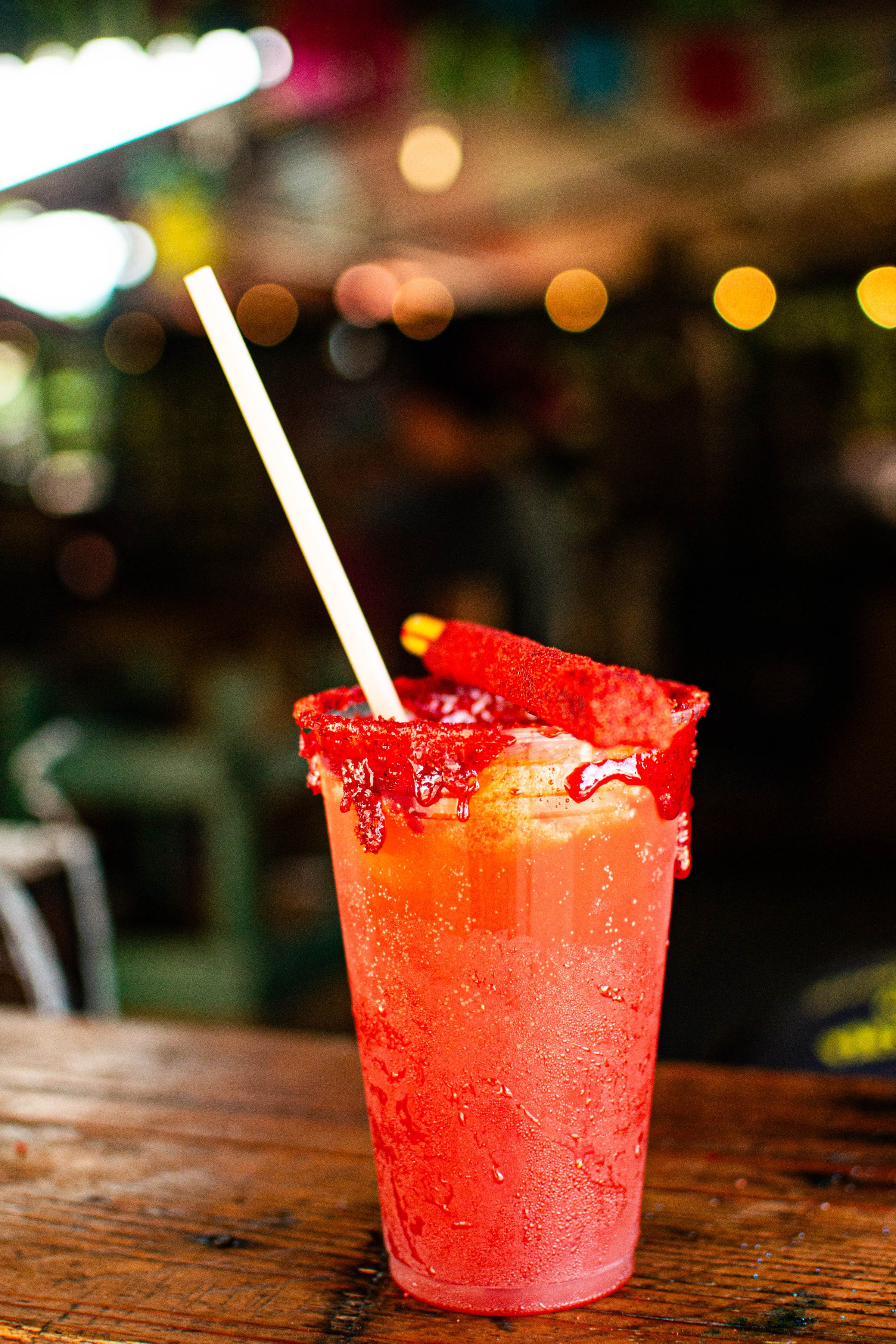 Refreshing traditional mexican drink with chili powder and tamarind candy celebrating independence day in september