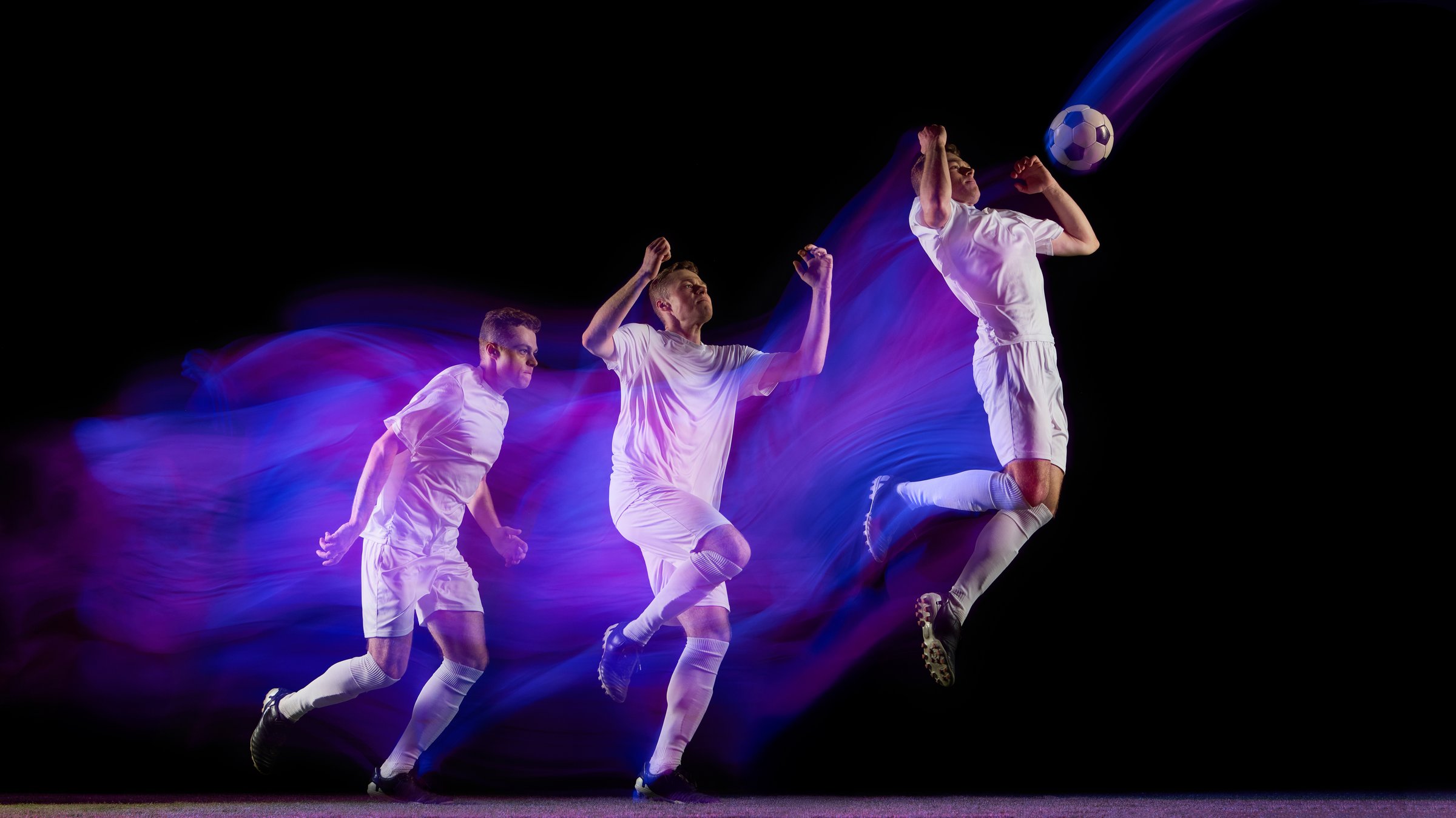 Sequence of soccer player jumping for header with glowing neon light motion. Concept of coordination, power, focus used in motion capture, athlete education, and sports analysis visuals.