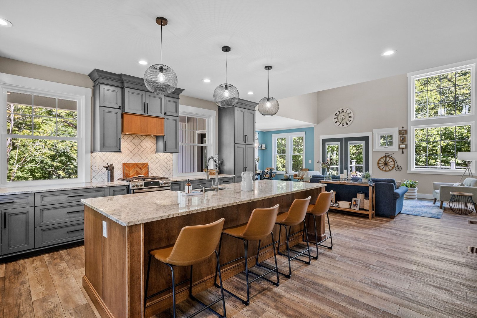 Professional kitchen renovation showcasing modern colonial style with large island, traditional charm elements, and clean minimalist design lines