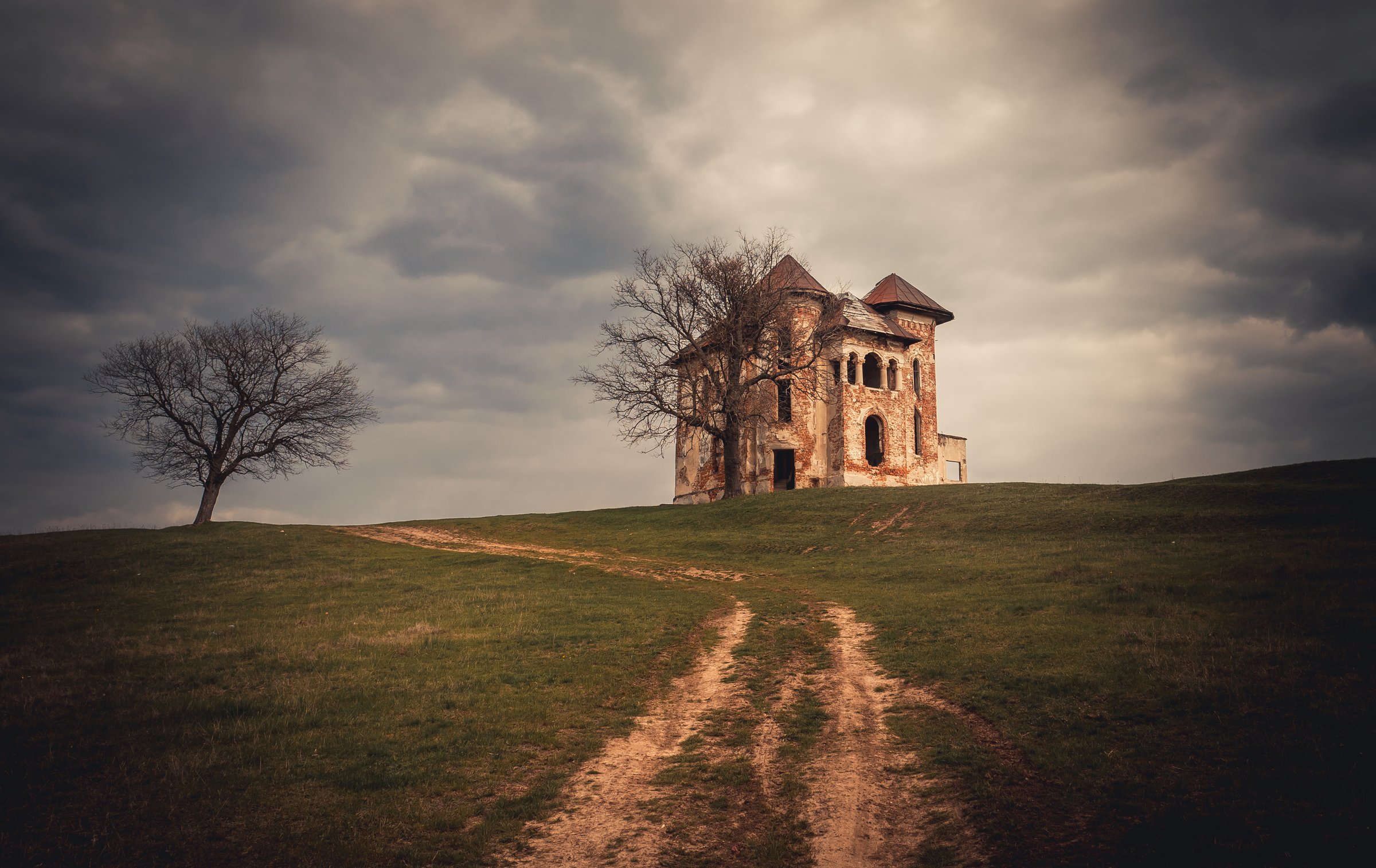 Abandoned castle in a dramatic setting.