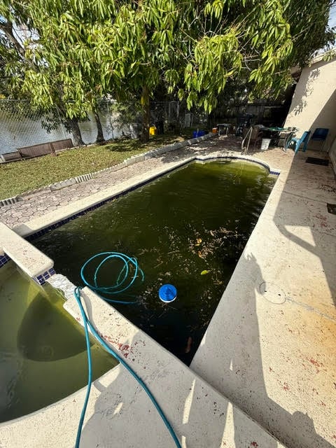 Before image of a pool with discoloration