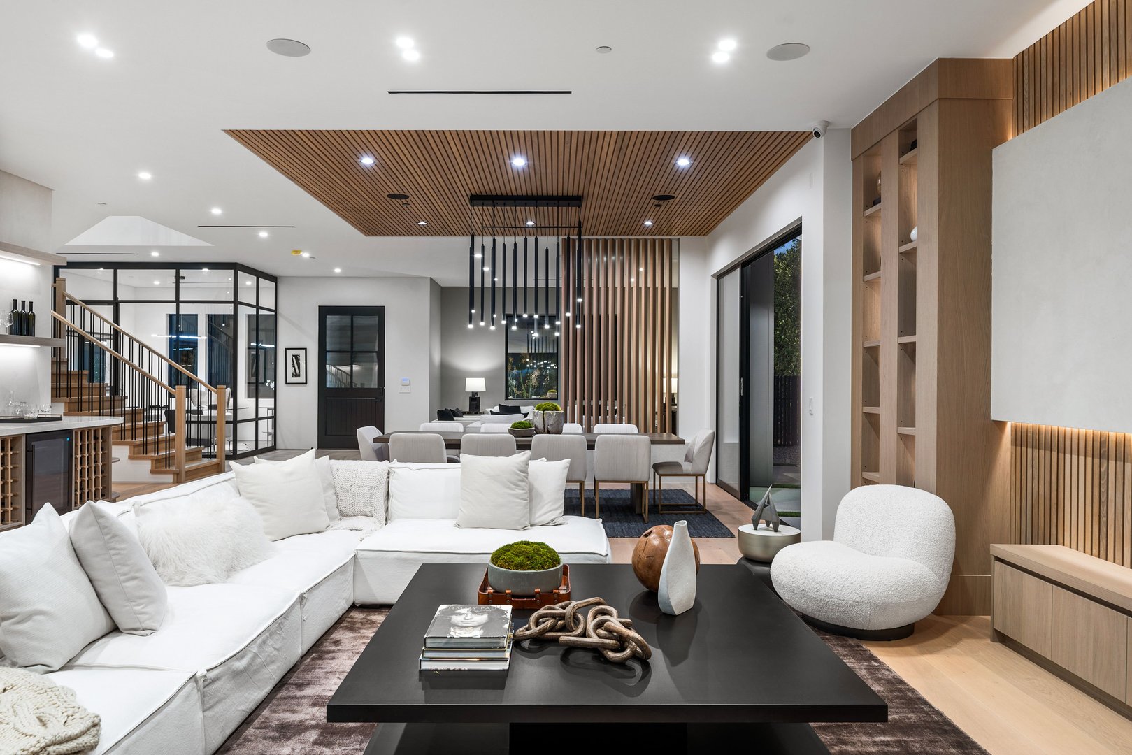 Modern living room interior with elegant furniture, wooden accents, and ambient lighting, showcasing a stylish and cozy atmosphere.