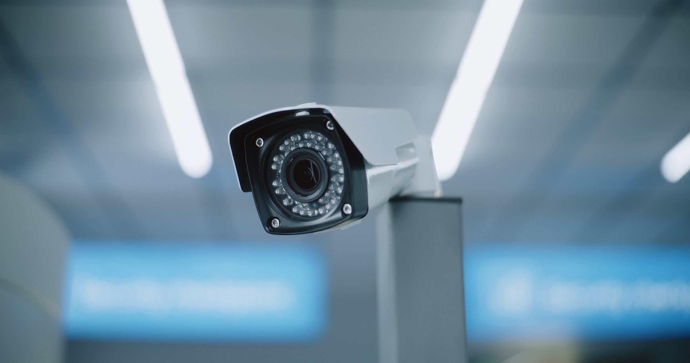 Advanced Airport Security System: Close Up of Installed CCTV Camera. Professional Video Surveillance System in Modern Airport Terminal. Monitoring, Tracking and Scanning Technology for Travel Safety.