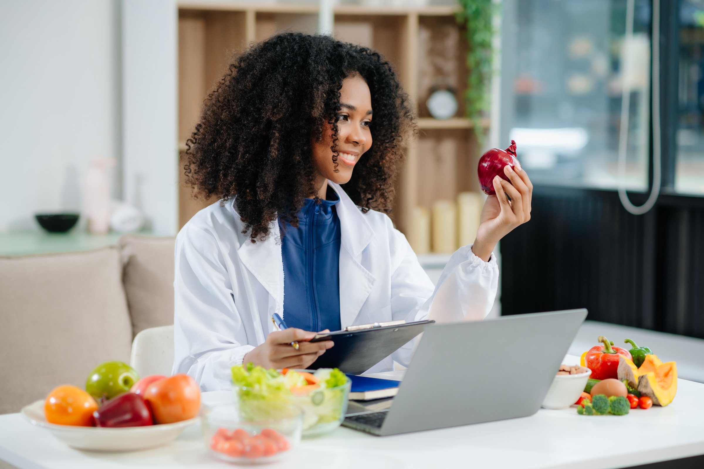Explore a clinical nutritionist assessing fresh produce and supplements for health, diet planning, and wellness. Perfect for themes of healthcare, nutrition, and balanced living