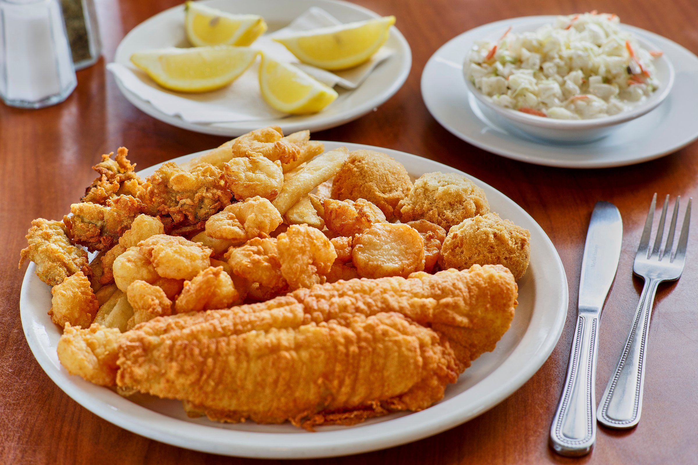 fried seafood platter with fresh fish, scallops, shrimp, and oysters