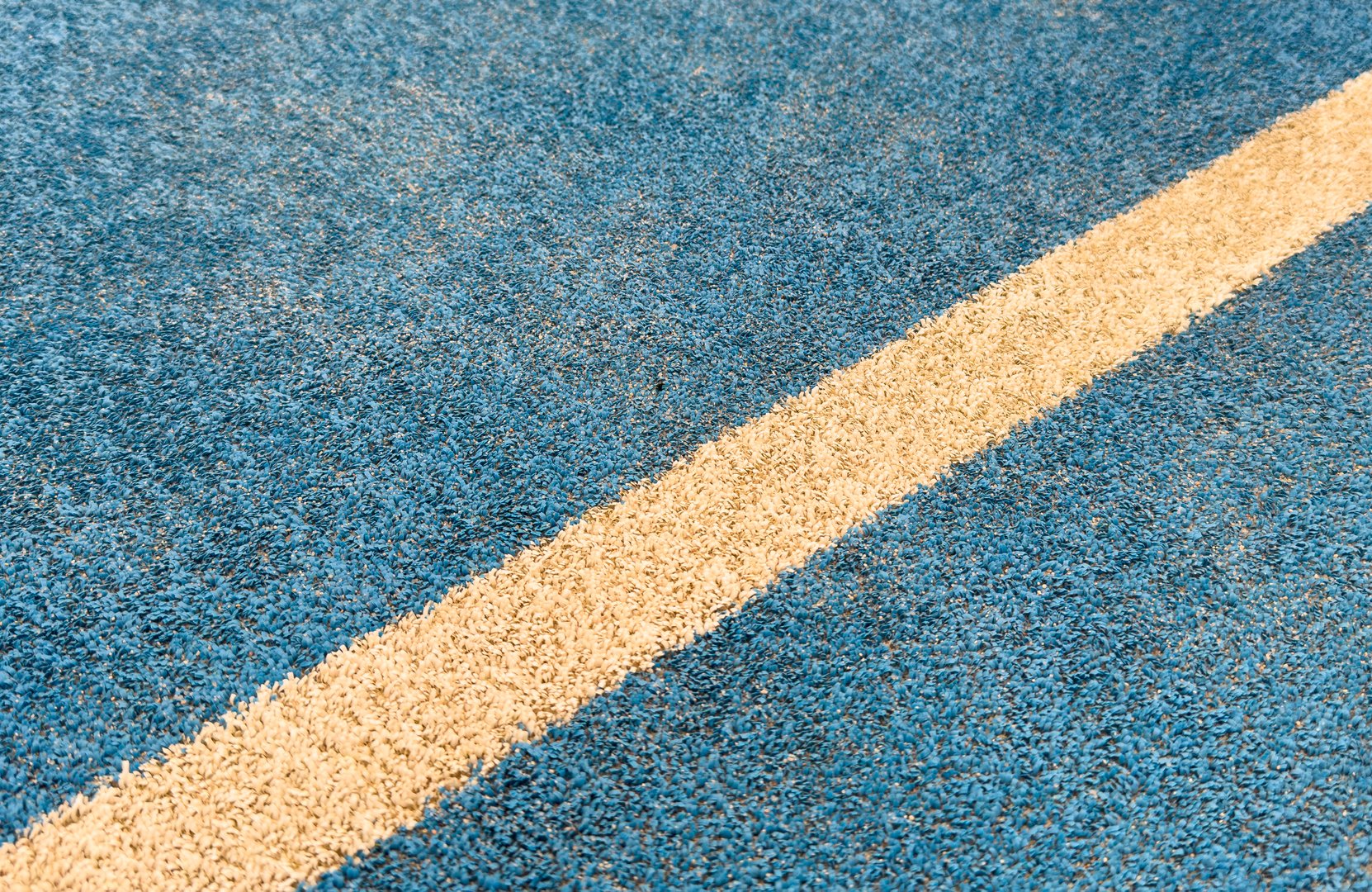 white line on a blue paddle tennis court.. High quality photo