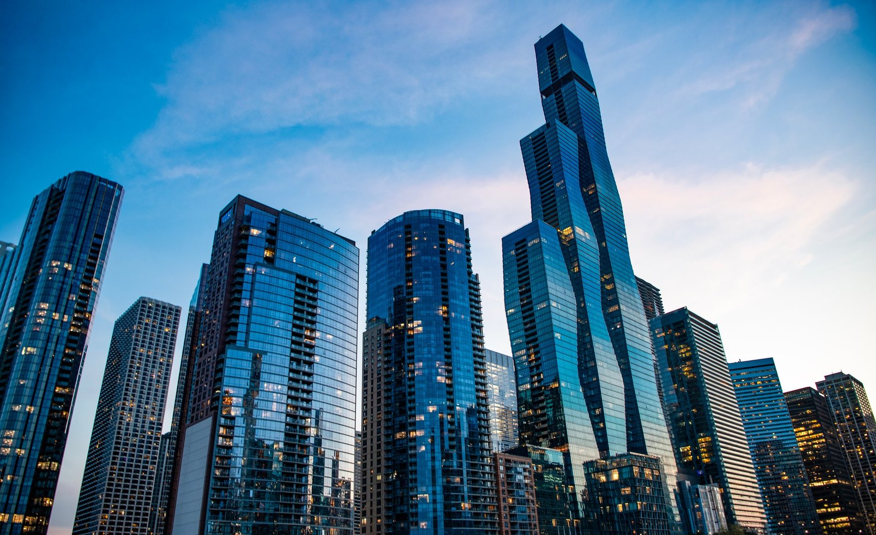 Skyscraper in city. City downtown with skyscraper. Office building business district. Modern building. Chicago city. High perspective. Skyscraper building architecture. Business skyscraper of glass.