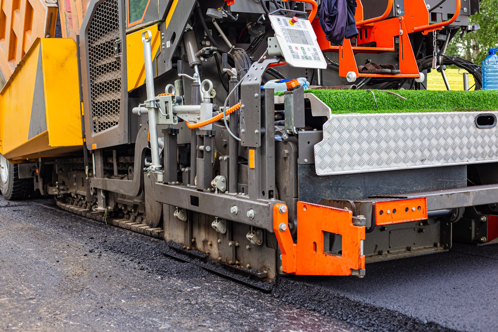 Vibratory asphalt rollers compactor compacting new asphalt pavement. Road service repairs the highway