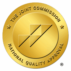 Gold seal of The Joint Commission indicating National Quality Approval for addiction treatment services.