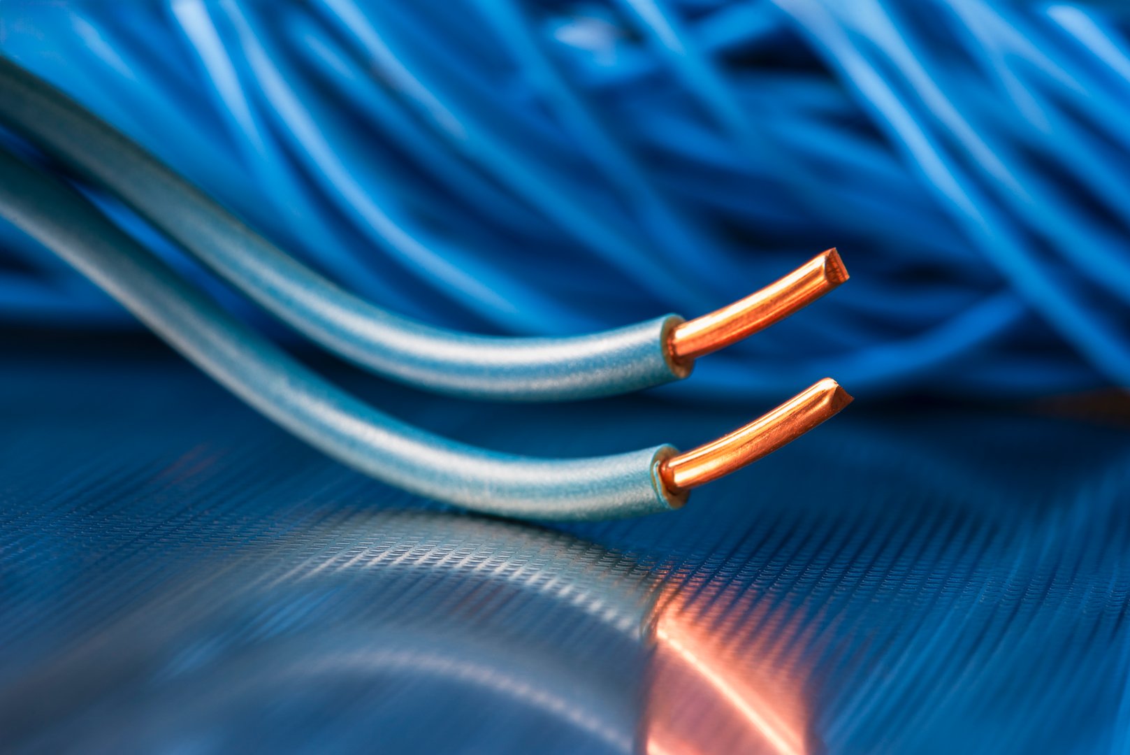 Electric cable wires in electrical installation on metallic surface