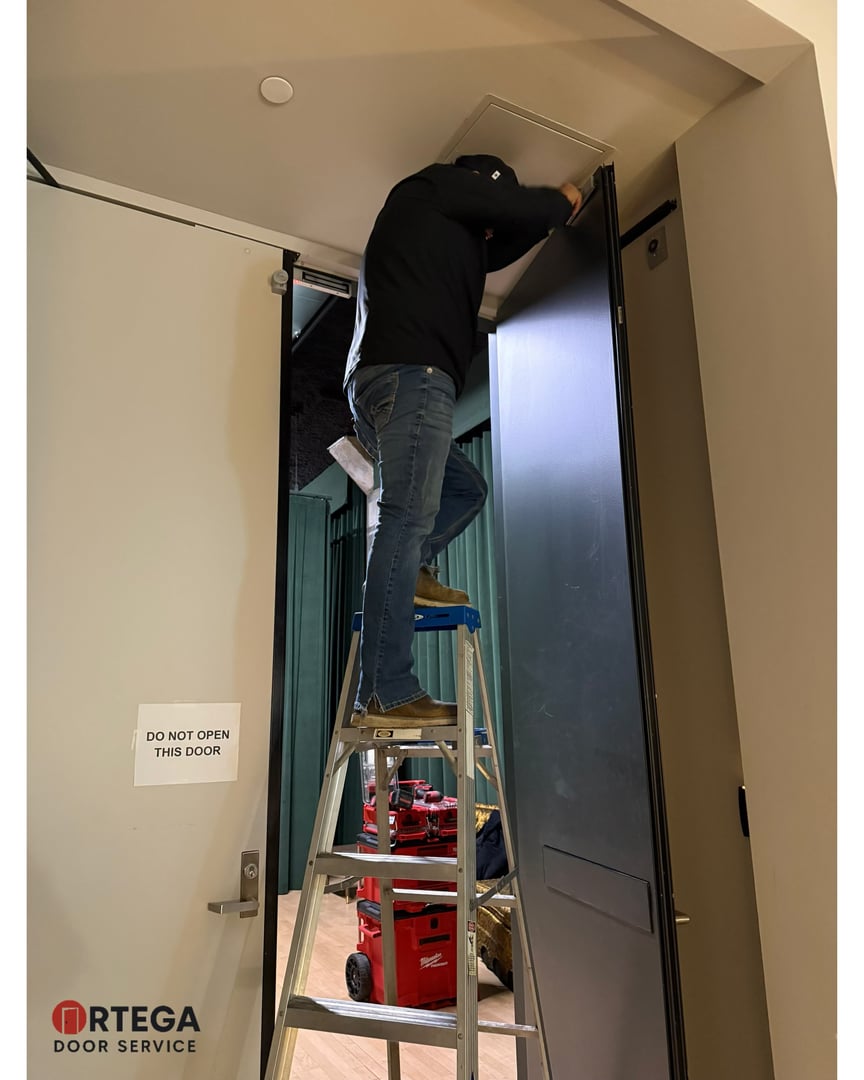 Ortega Door technician working on commercial door repair