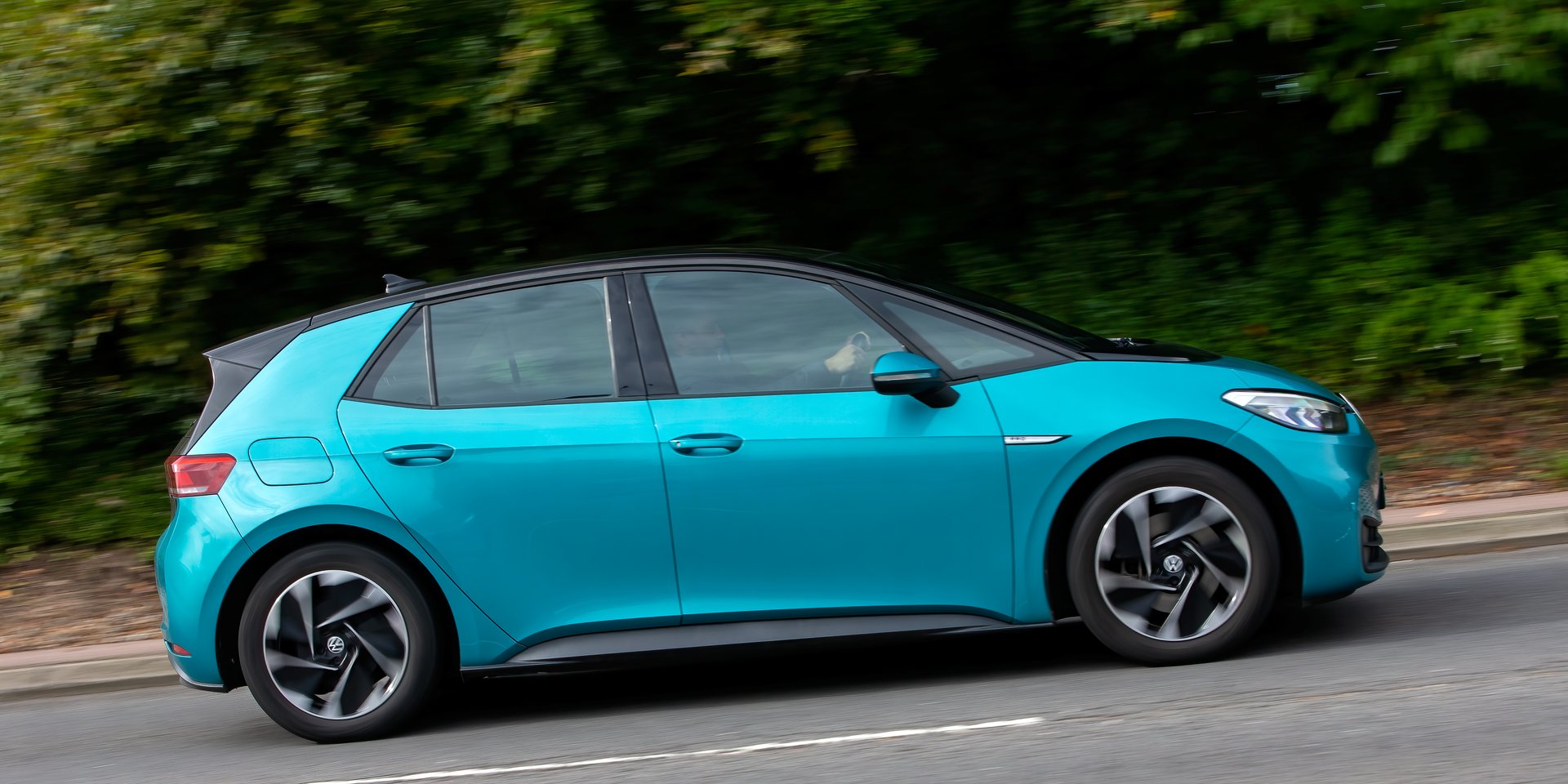 Milton Keynes,UK - Sept 29th 2024: 2021 turquoise Volkswagen ID3 life electric car driving on a British road