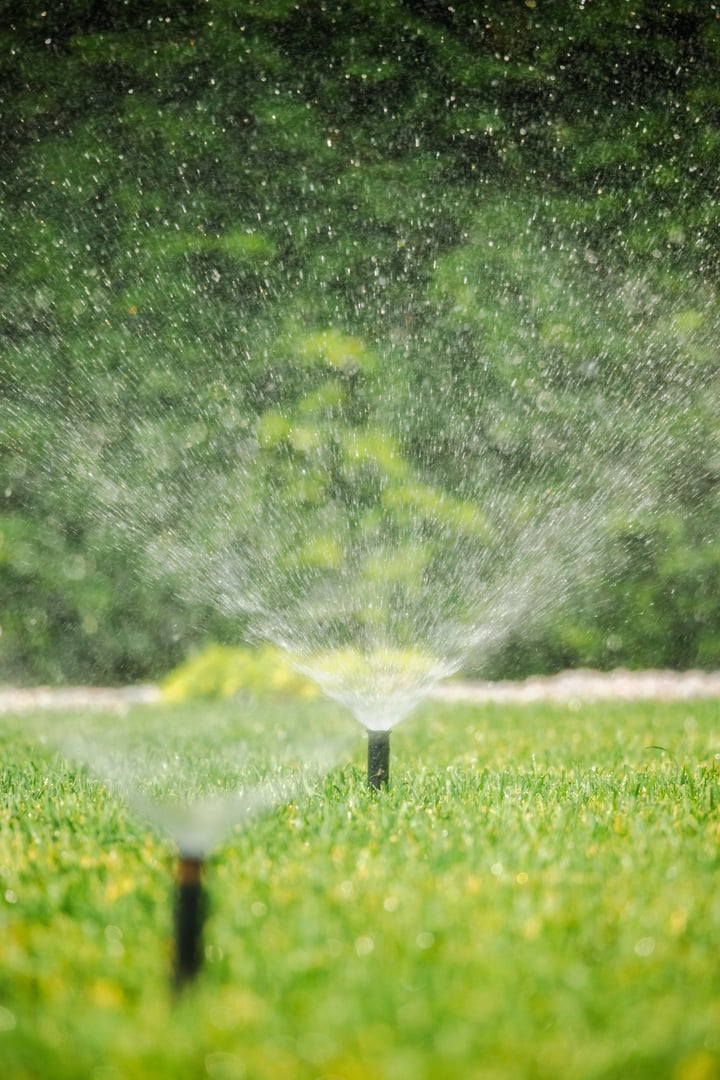 Automatic sprinkler system watering lawn