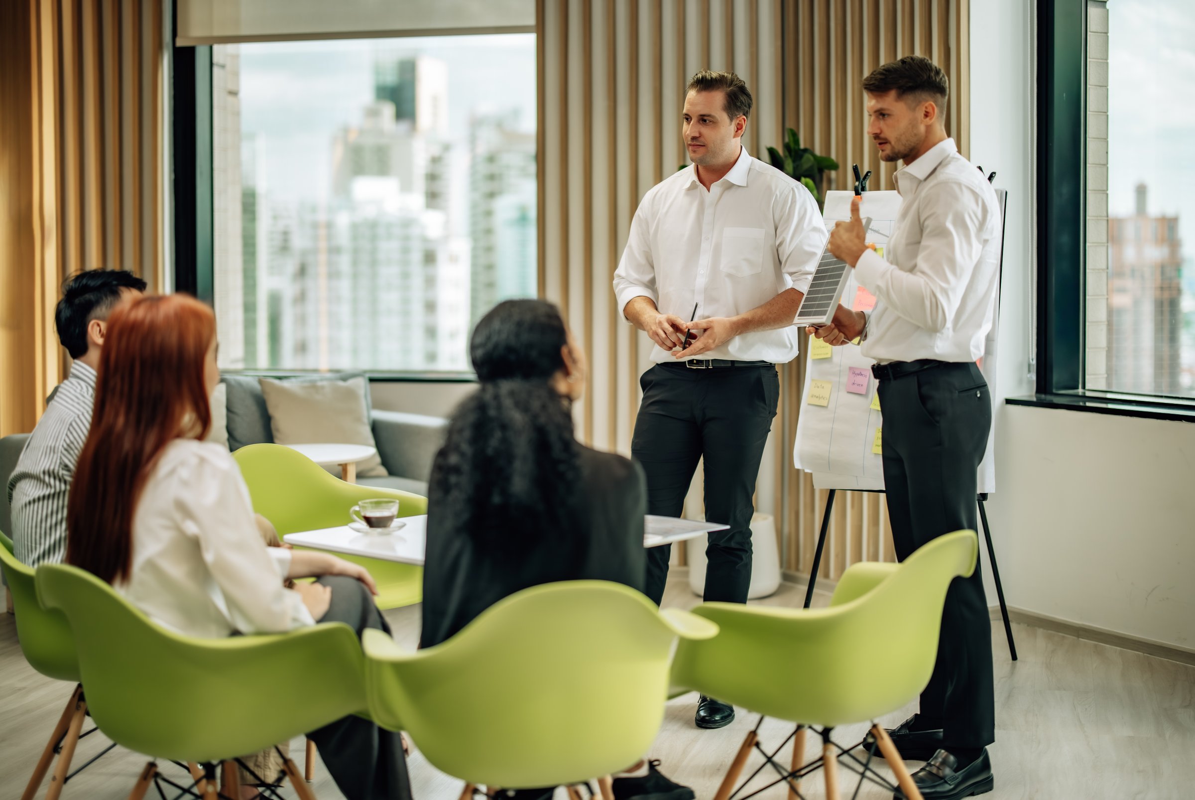 In multicultural workspace, innovative project manager present sustainable solar panel product, fostering collaboration and diversity among colleagues, aiming for efficient, renewable energy solution