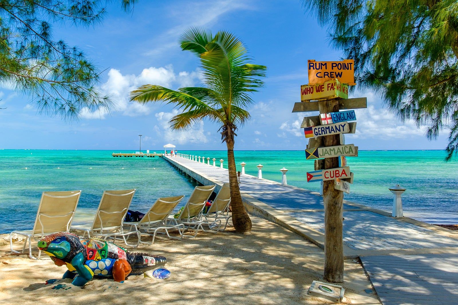 Two empty beach chairs on a summer sunny day at the beach in Punta Cana, Dominican Republic.  Amazing beach scene vacation and summer holiday concept.