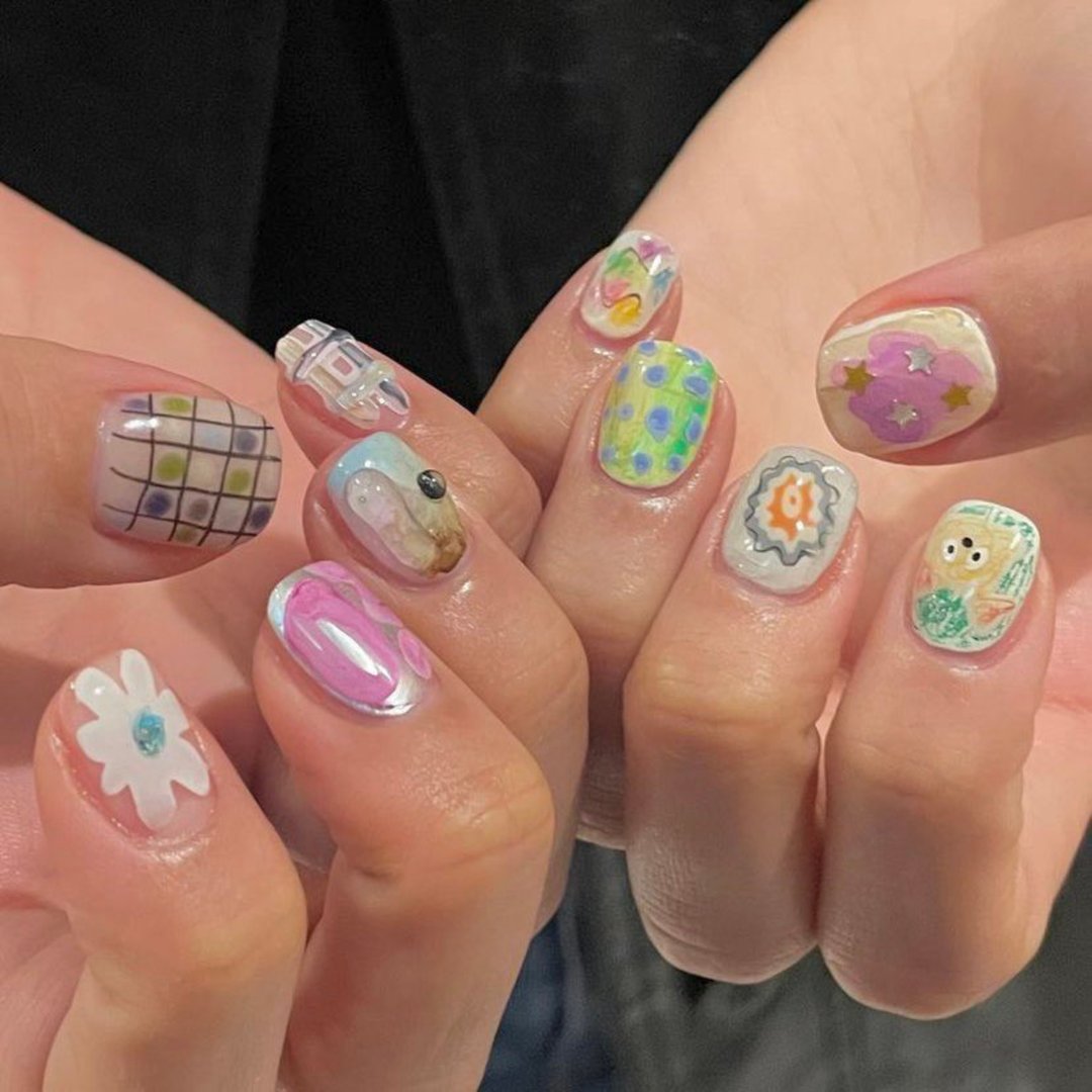 Creative nail art featuring intricate designs, vibrant colors, and unique patterns. Perfect for beauty and fashion photography, showcasing trends in nail designs and the artistry of manicure techniques.