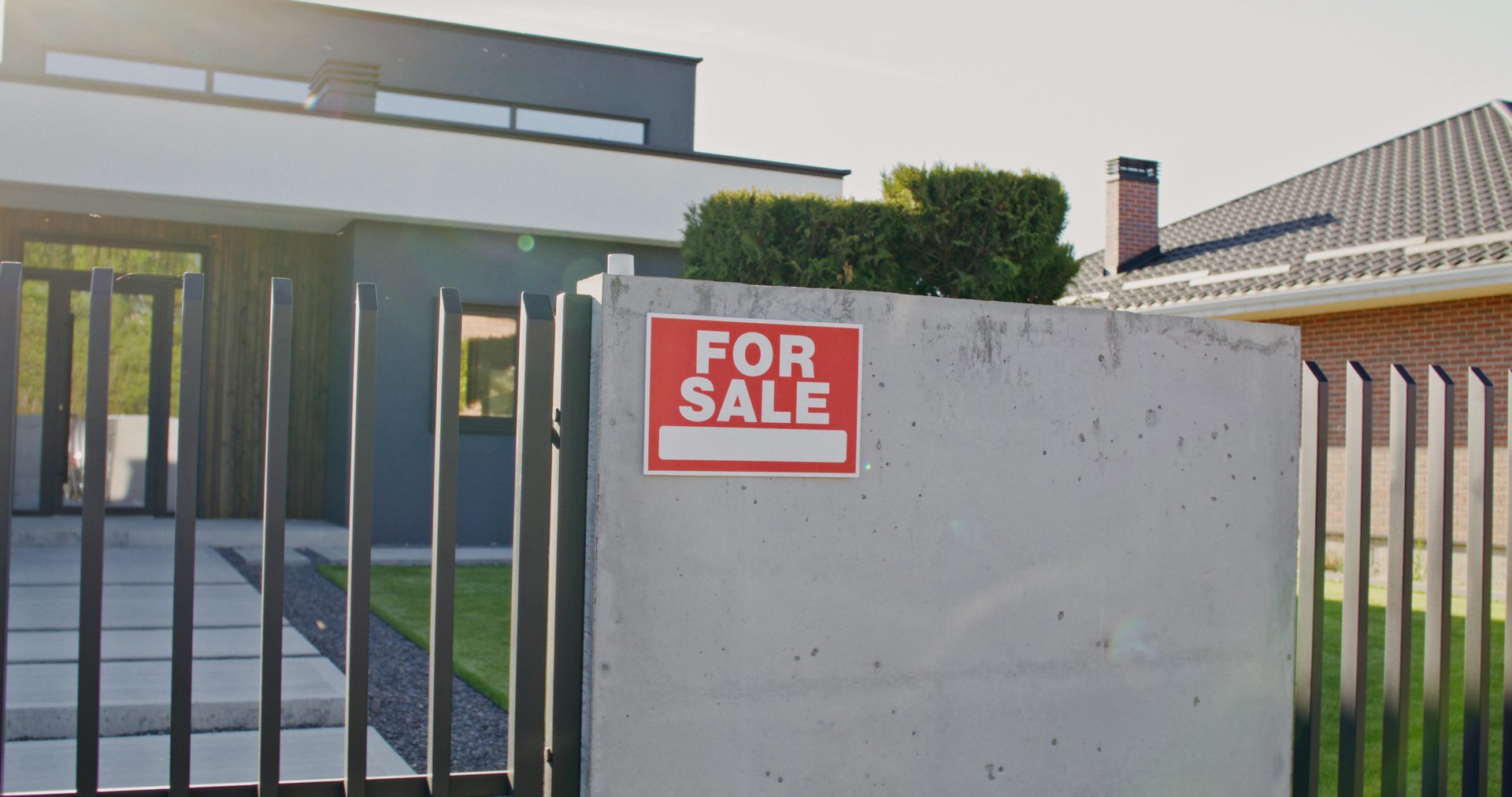 The house is for sale. Close-up of the sign on the fence with the inscription for sale