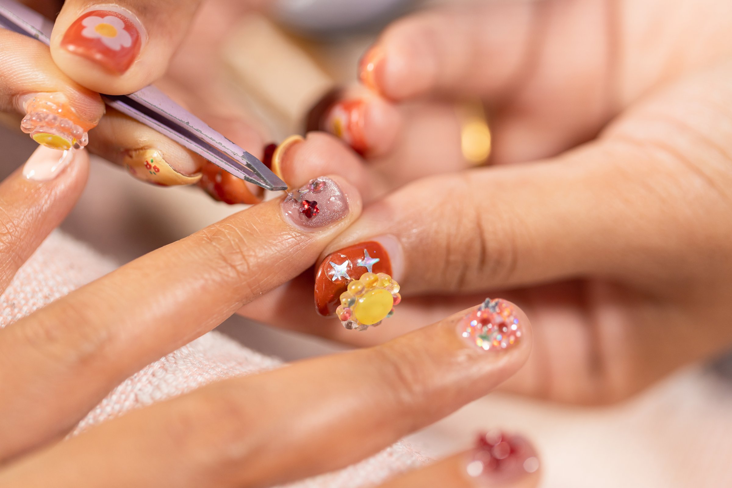 Nail art treatment at home nail salon brings beauty and fashion together with detailed designs and decorations for stylish and elegant look