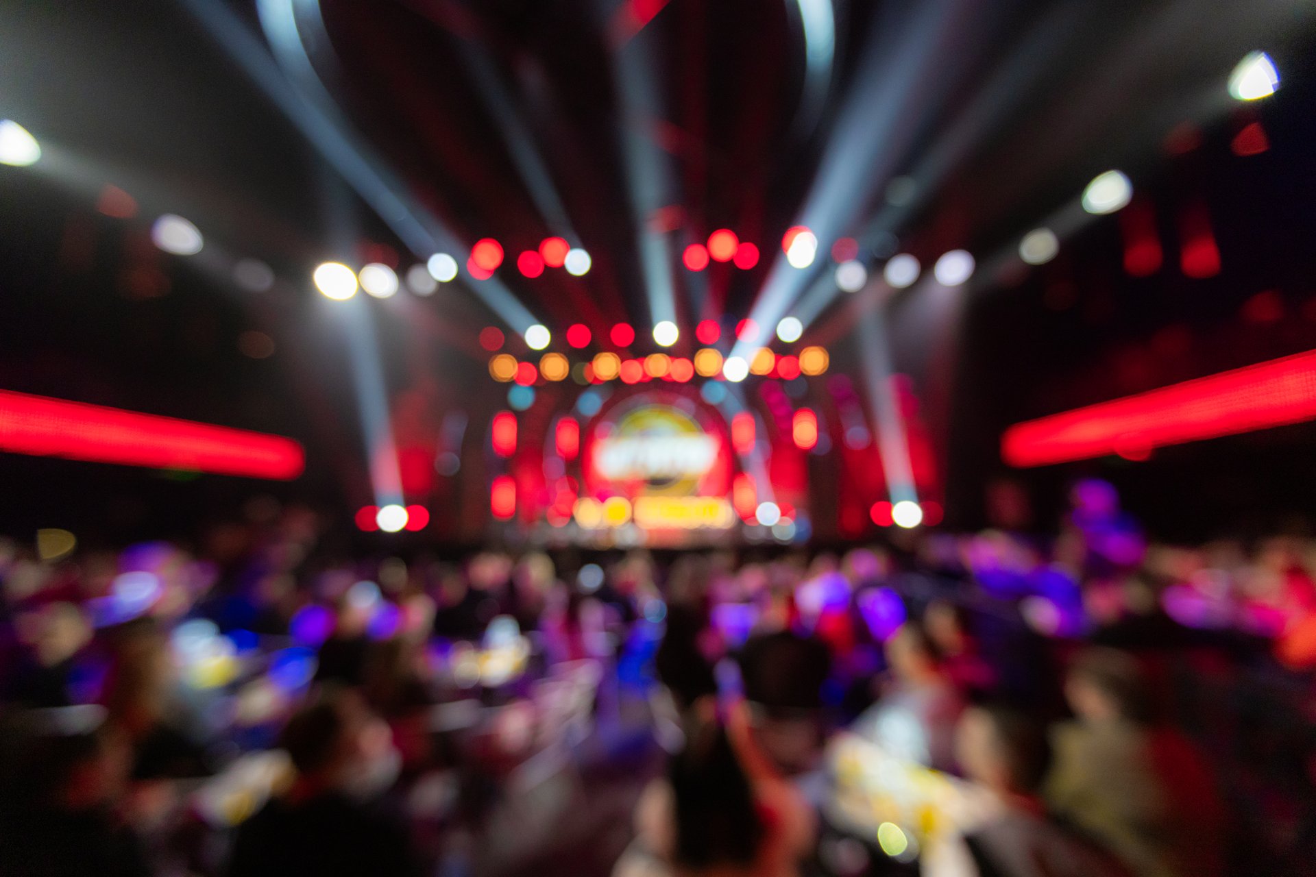 Defocused blurred concert lighting on stage for design purpose