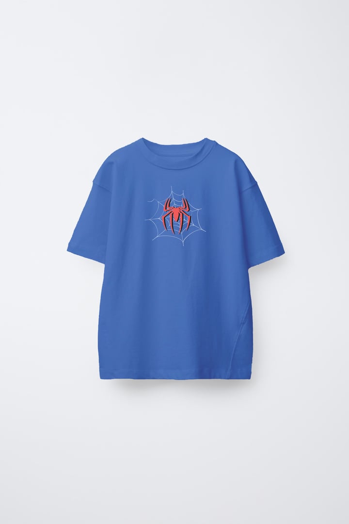 Blue T-shirt featuring a red spider emblem on a web design in the center.
