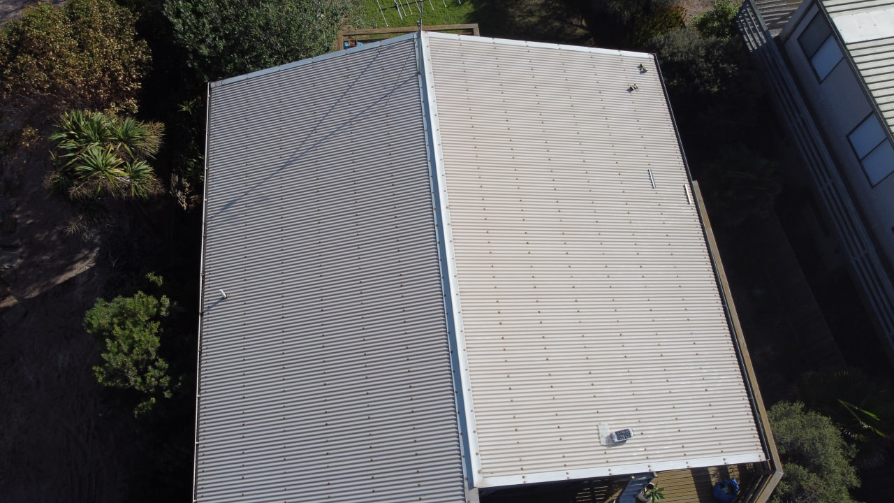 Before roof painting - weathered and faded metal roof requiring restoration